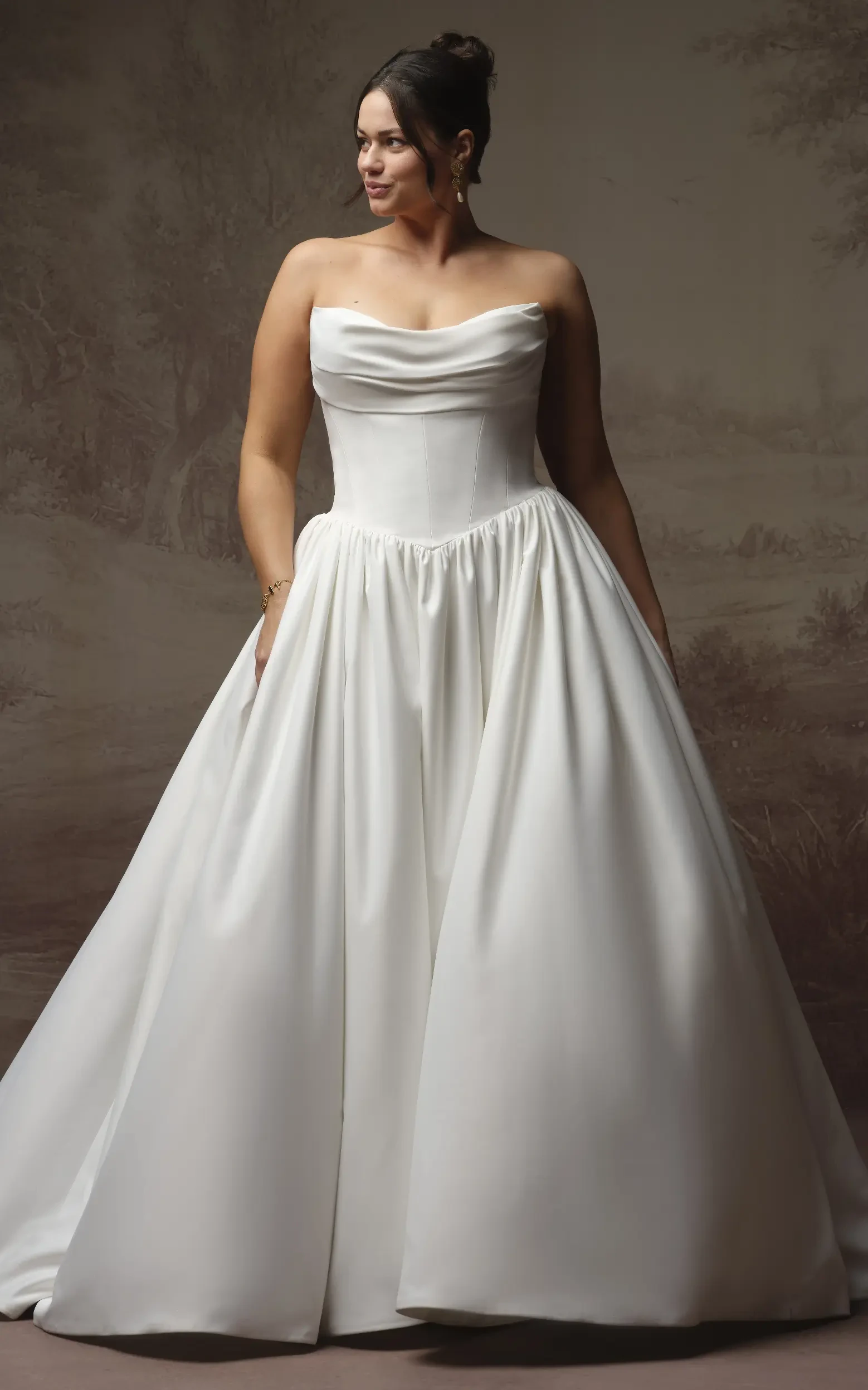 Model In Studio Wearing Simple Ballgown Wedding Dress Called Vanessa By Rebecca Ingram
