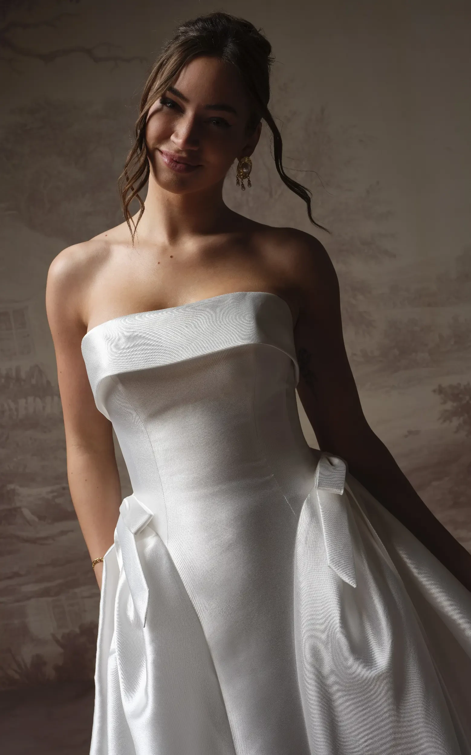 Model Wearing Satin Wedding Dress With Bows Called Gemma By Maggie Sottero