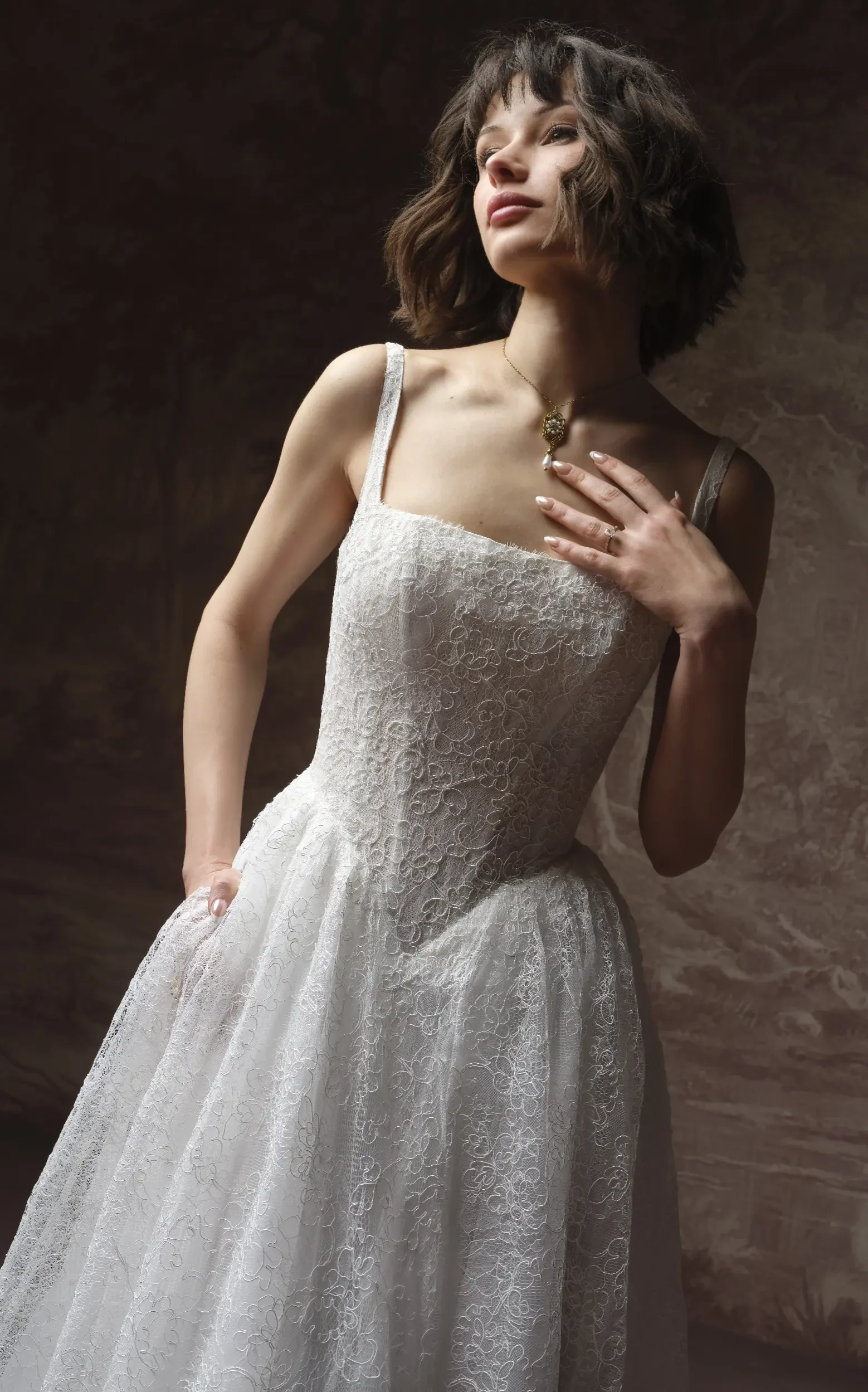 Model In Studio Wearing Lace A-line Wedding Dress Called Autumn By Maggie Sottero