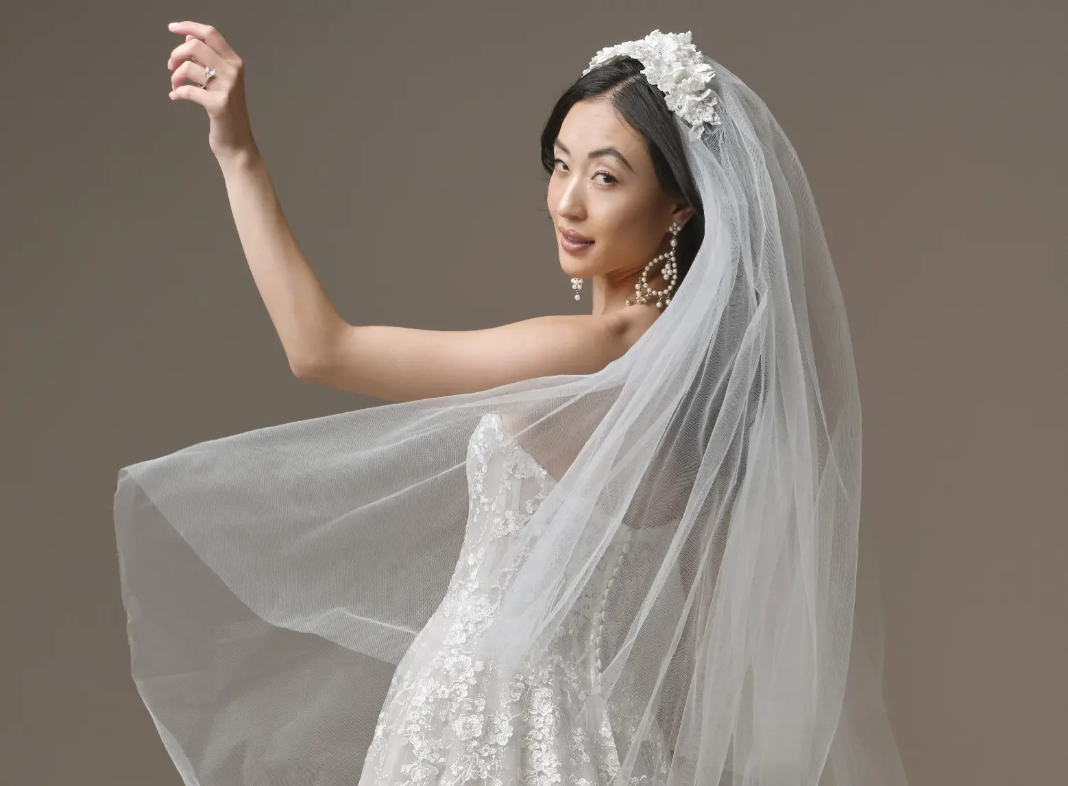 Model In A Studio Wearing A Veil And A Western Wedding Dress Called Memphis By Maggie Sottero