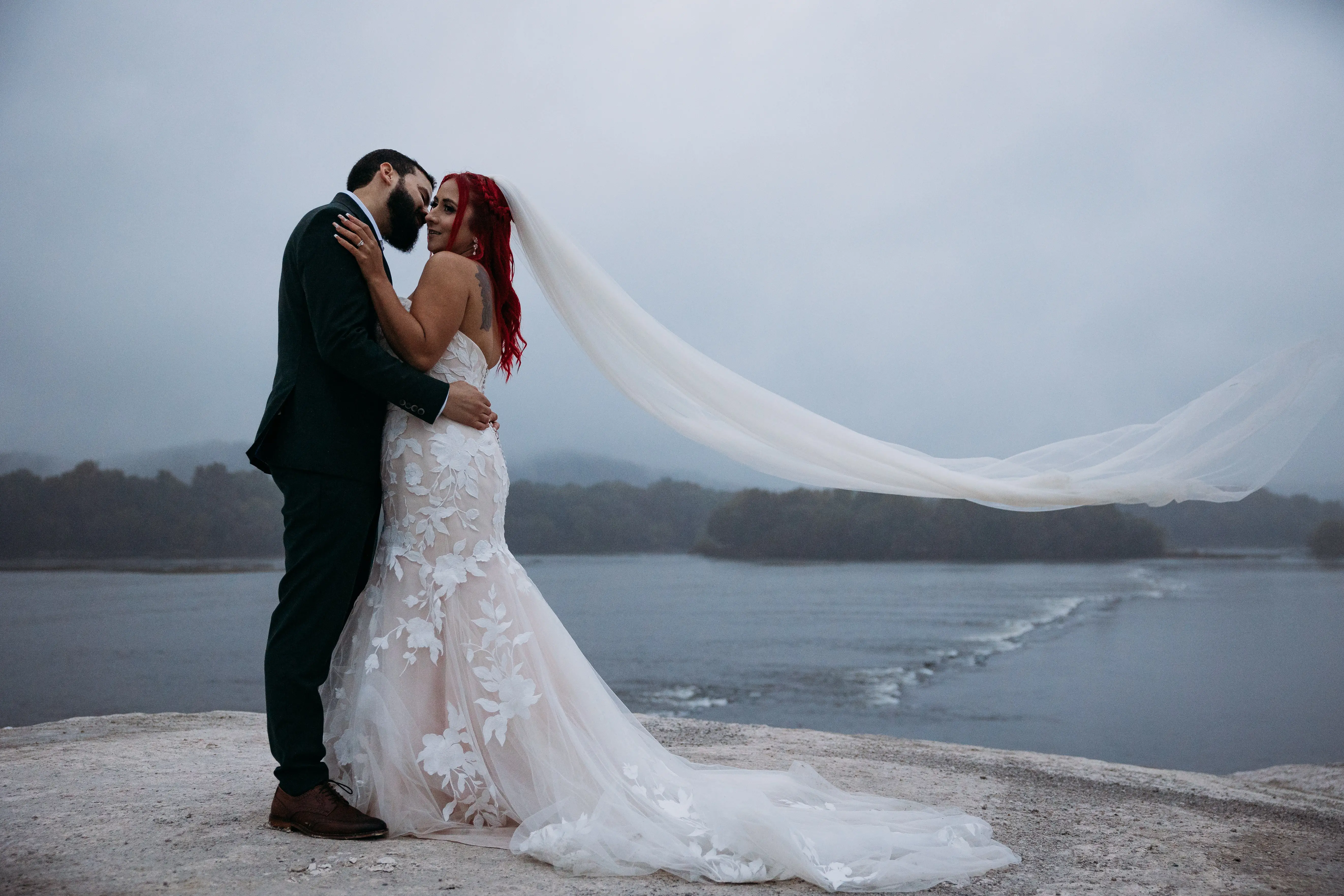 Groom On The Beach With Bride In White Dress Named Hattie By Rebecca Ingram