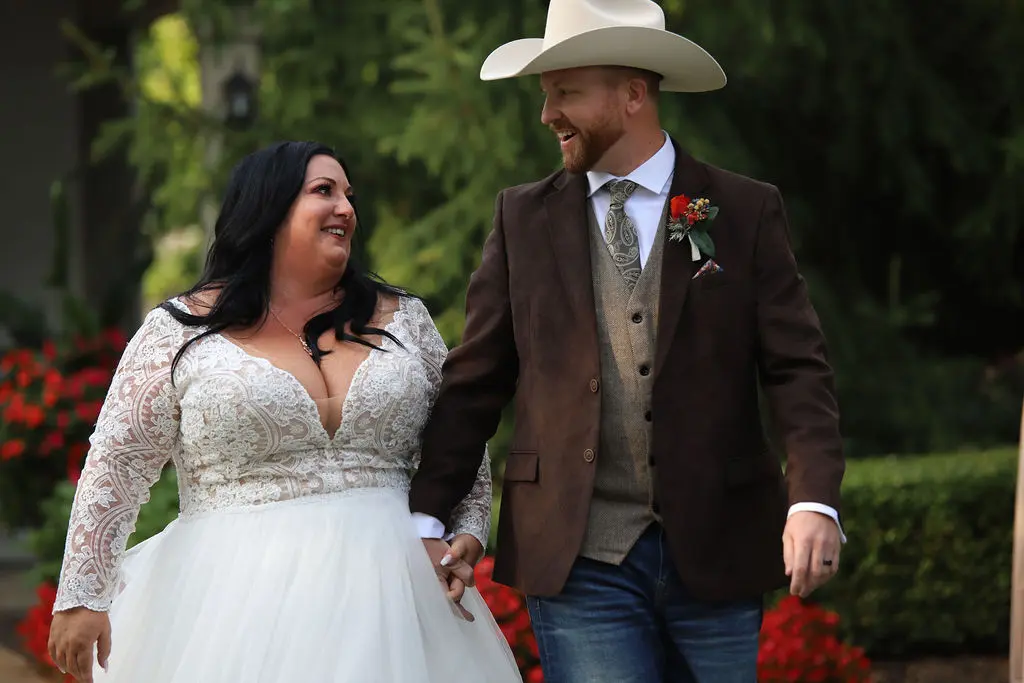 Bride wearing Princess Ballgown Wedding Dress called Mallory Dawn by Maggie Sottero and groom