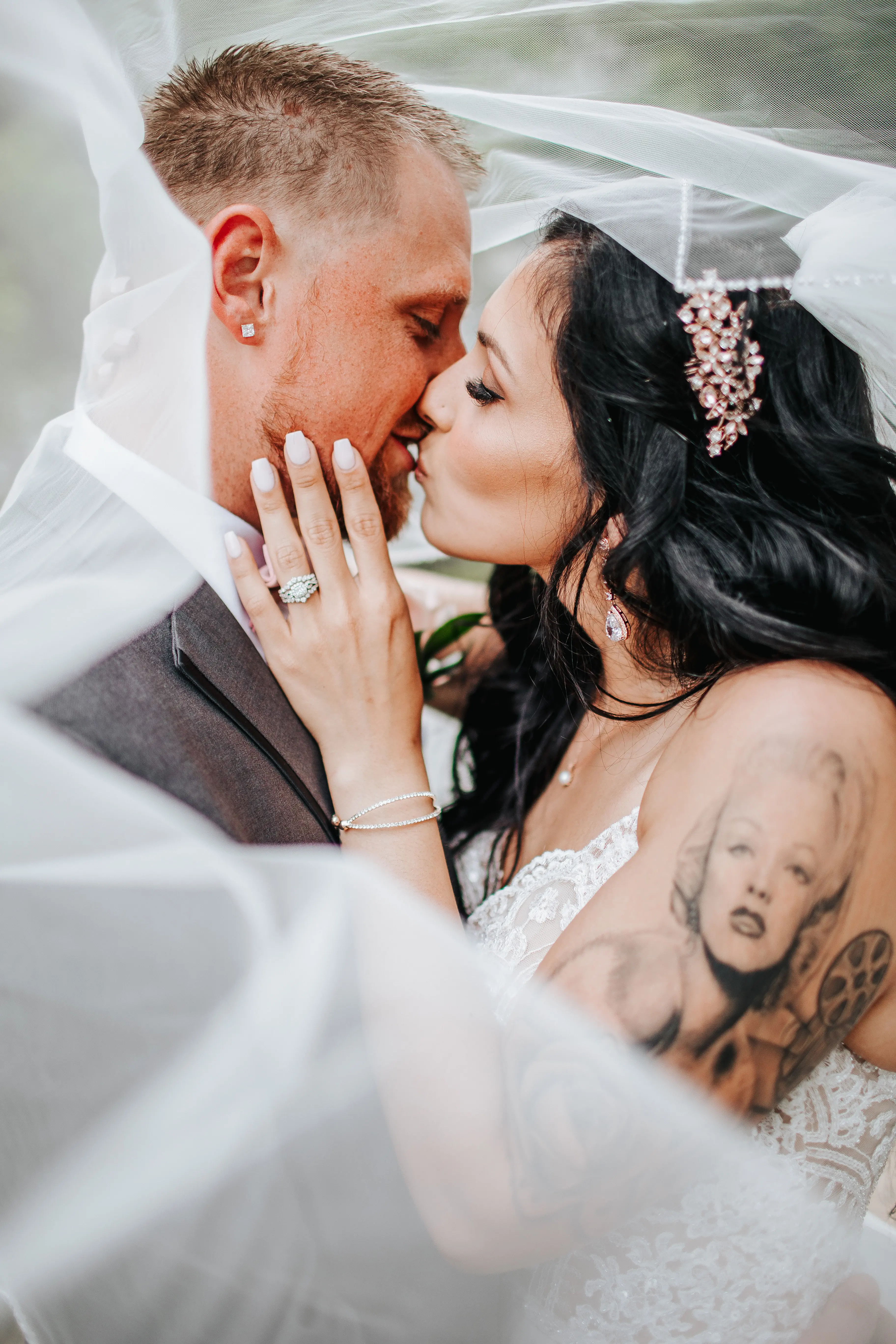 Bride with groom wearing boho princess wedding dress