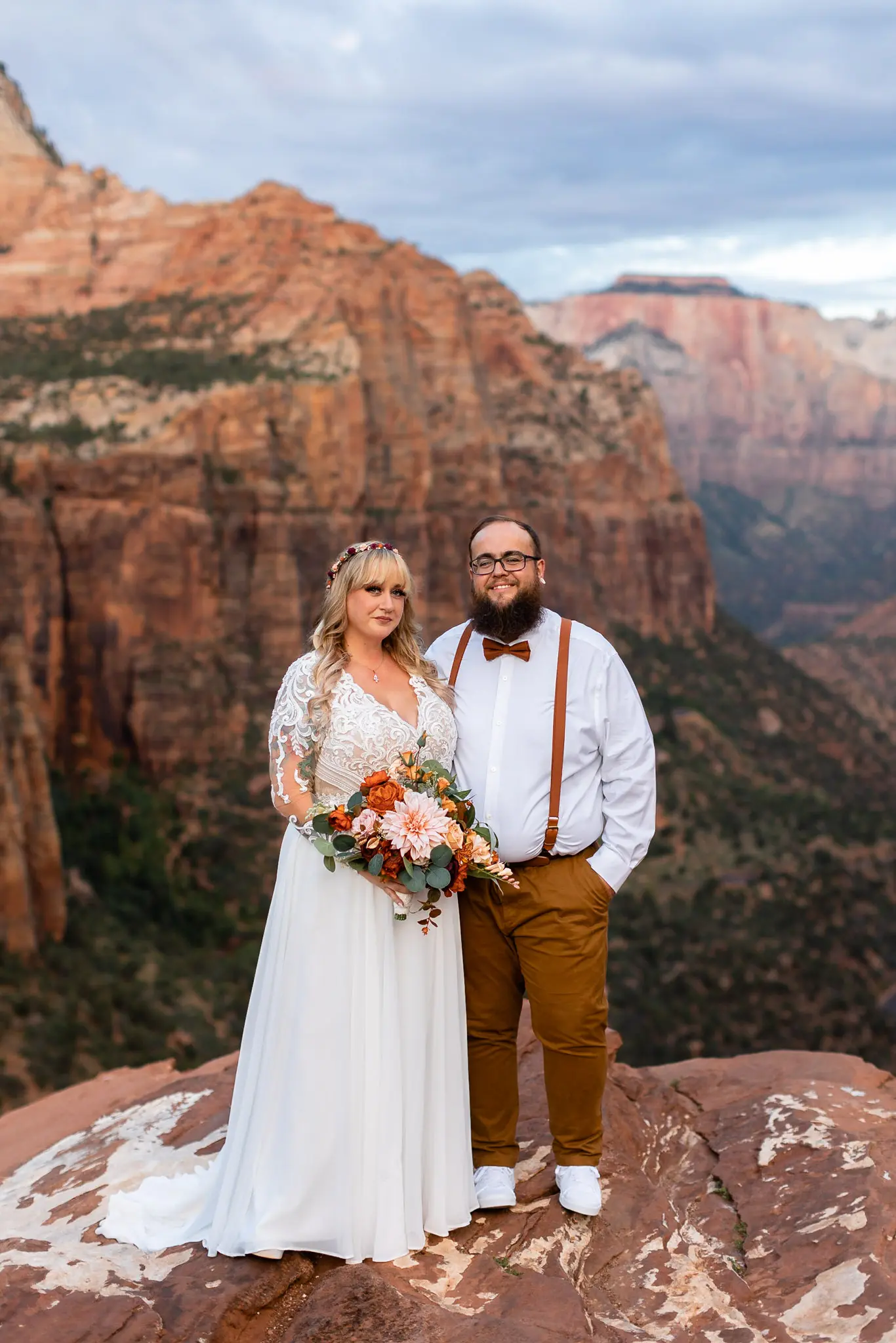Real Bride in Long Sleeved, Thigh-High Slit Wedding Dress Named Lorraine by Rebecca Ingram with Groom