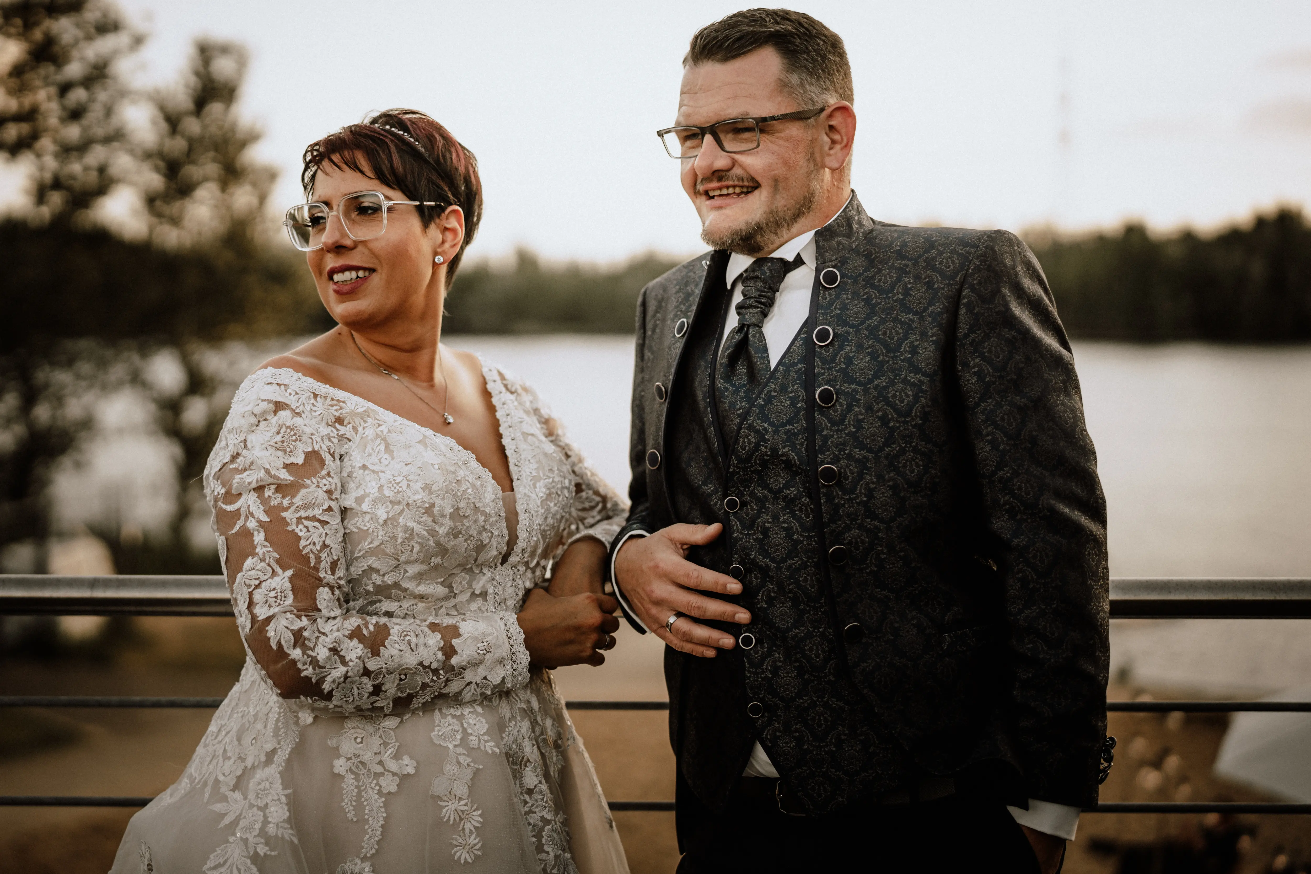 Bride in Long Sleeve Ivory Wedding Dress Raphael with Groom