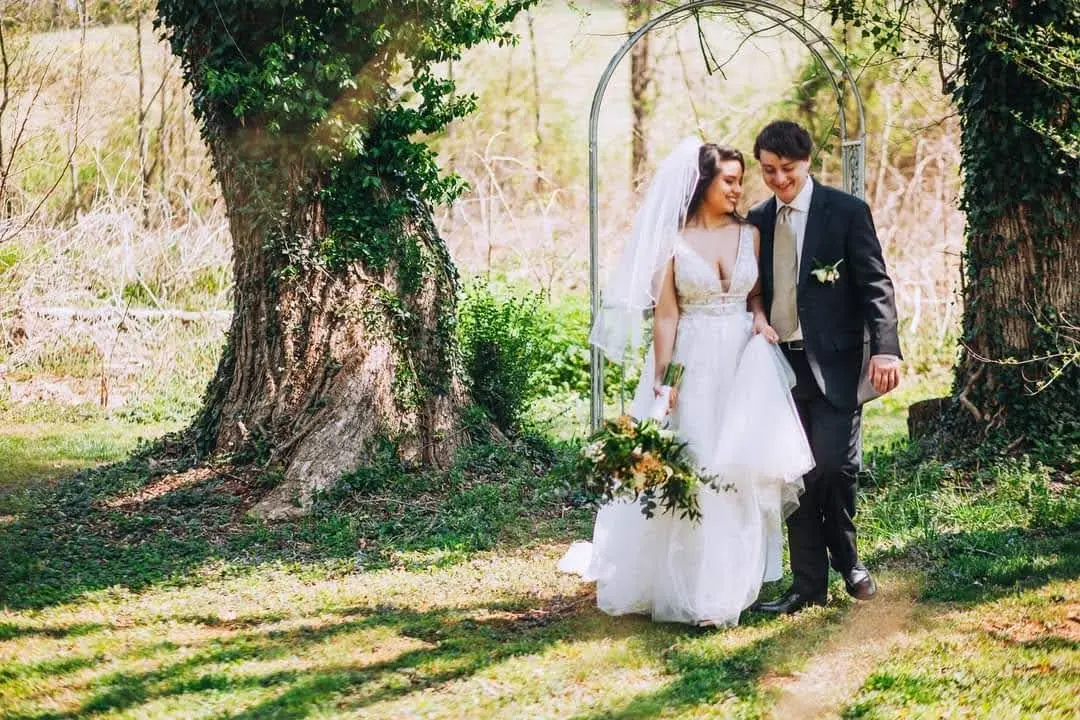 Groom With Bride Wearing Lace A-Line Wedding Dress Raelynn By Rebecca Ingram