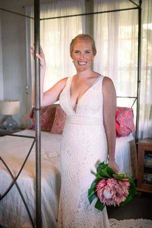 Real Bride in Boho Oversized Floral Lace Wedding Dress with Deep V-Neckline and Pearl Buttons Called Burke by Maggie Sottero
