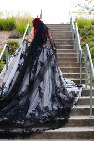 Bride Wearing Royal-Inspired Ball Gown Wedding Dress In Black Lace Called Norvinia By Sottero And Midgley