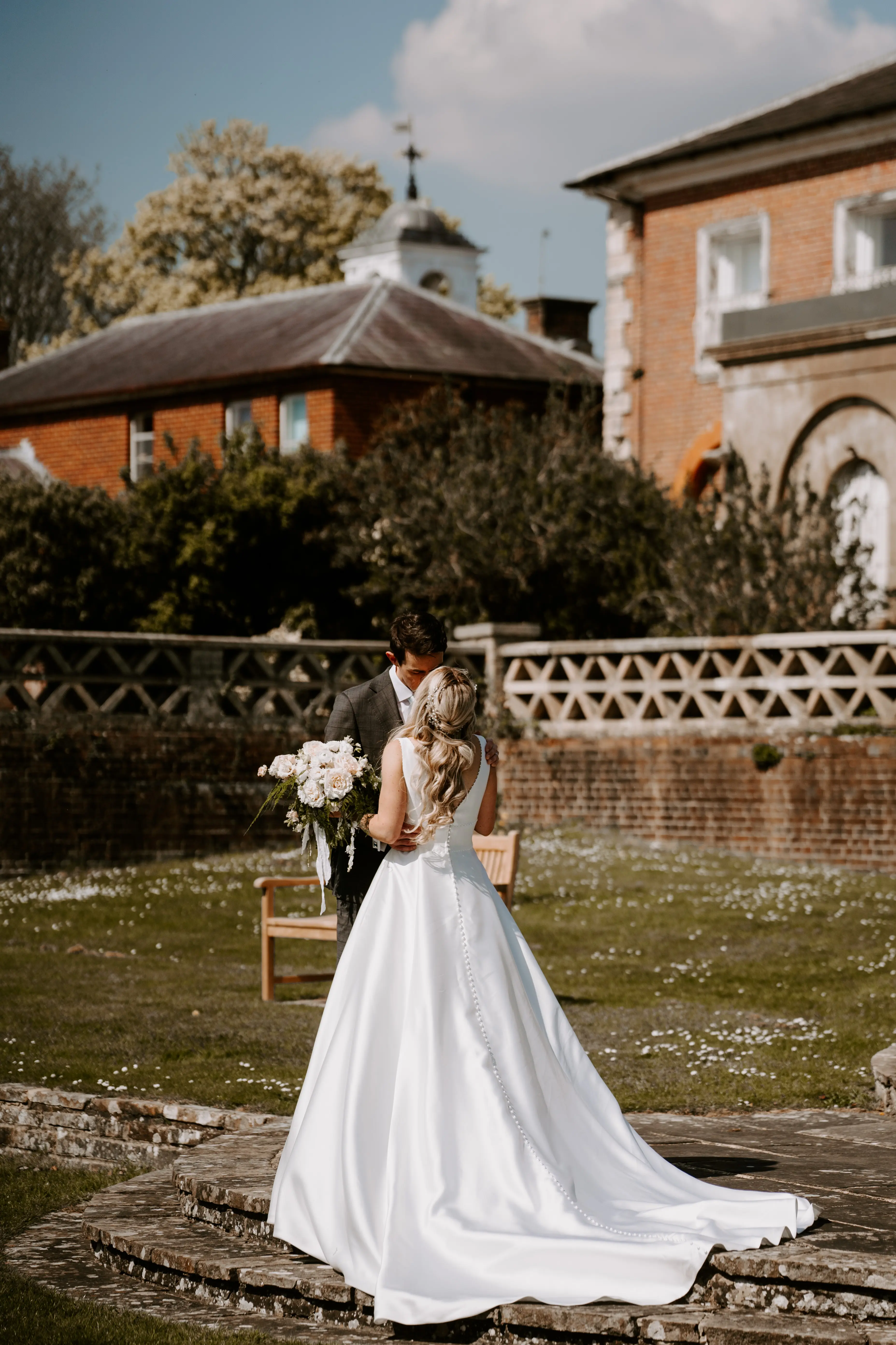 Groom With Bride Wearing Mikado A-Line Wedding Dress Raven By Maggie Sottero
