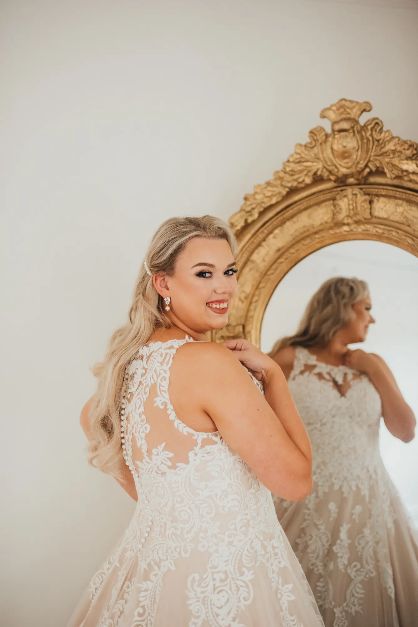 Bride wearing a plus size ballgown wedding dress.