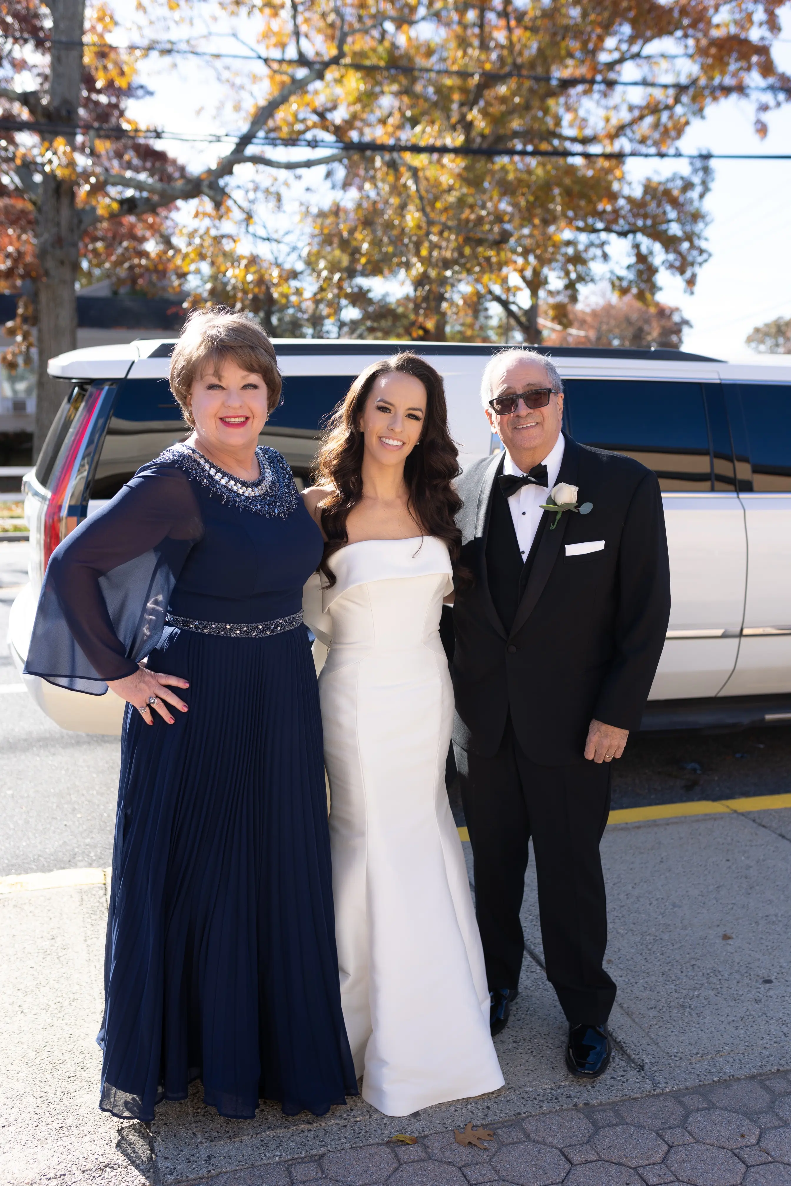 Bride wearing Mitchell Marie by Maggie Sottero with her parents
