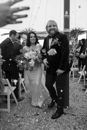 Bride wearing Luella wedding dress by Sottero and Midgley with her husband