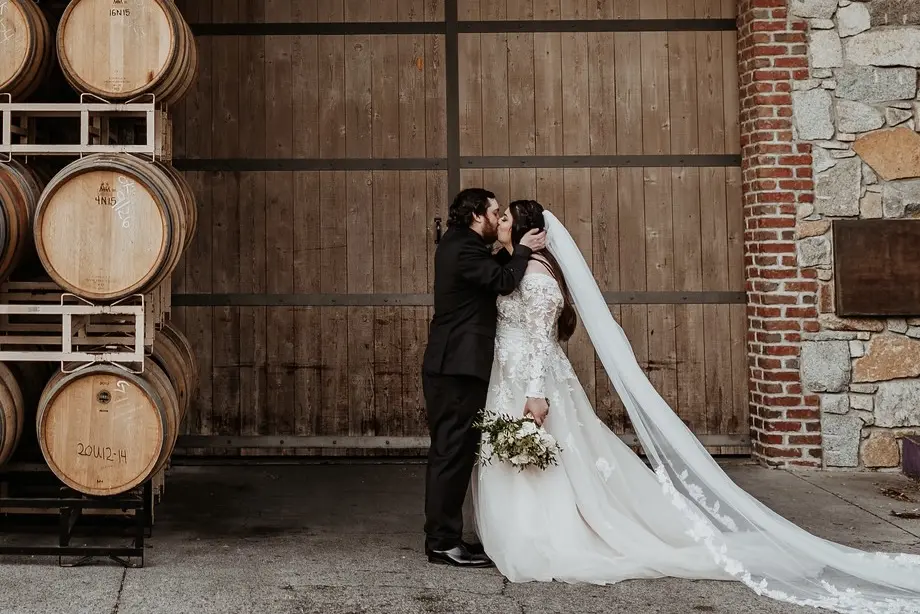 Real Bride wearing long sleeve A-Line wedding dress called Raphael by Maggie Sottero.