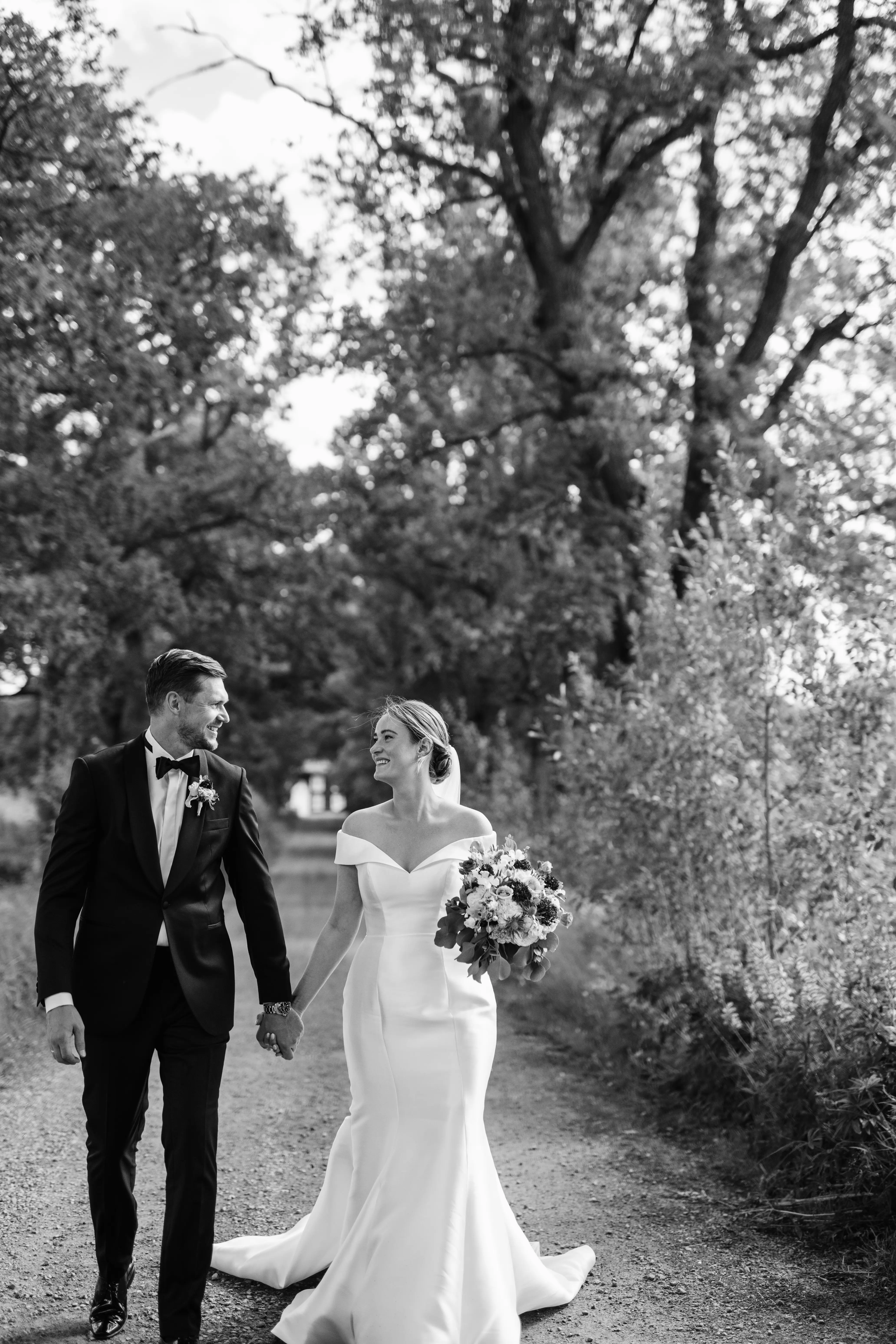 Groom With Bride Wearing Off The Shoulder Fit And Flare Josie By Rebecca Ingram