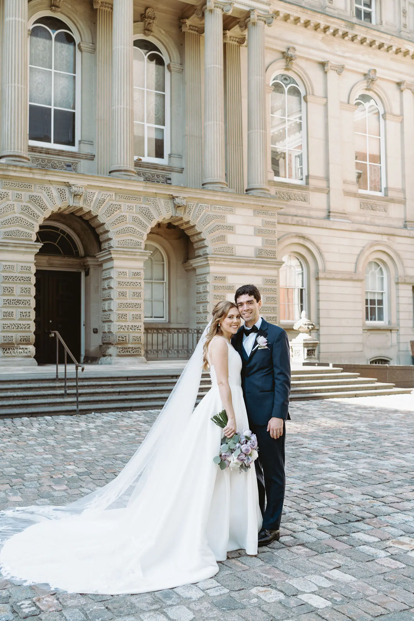 Bride wearing Selena wedding gown by Maggie Sottero with her husband