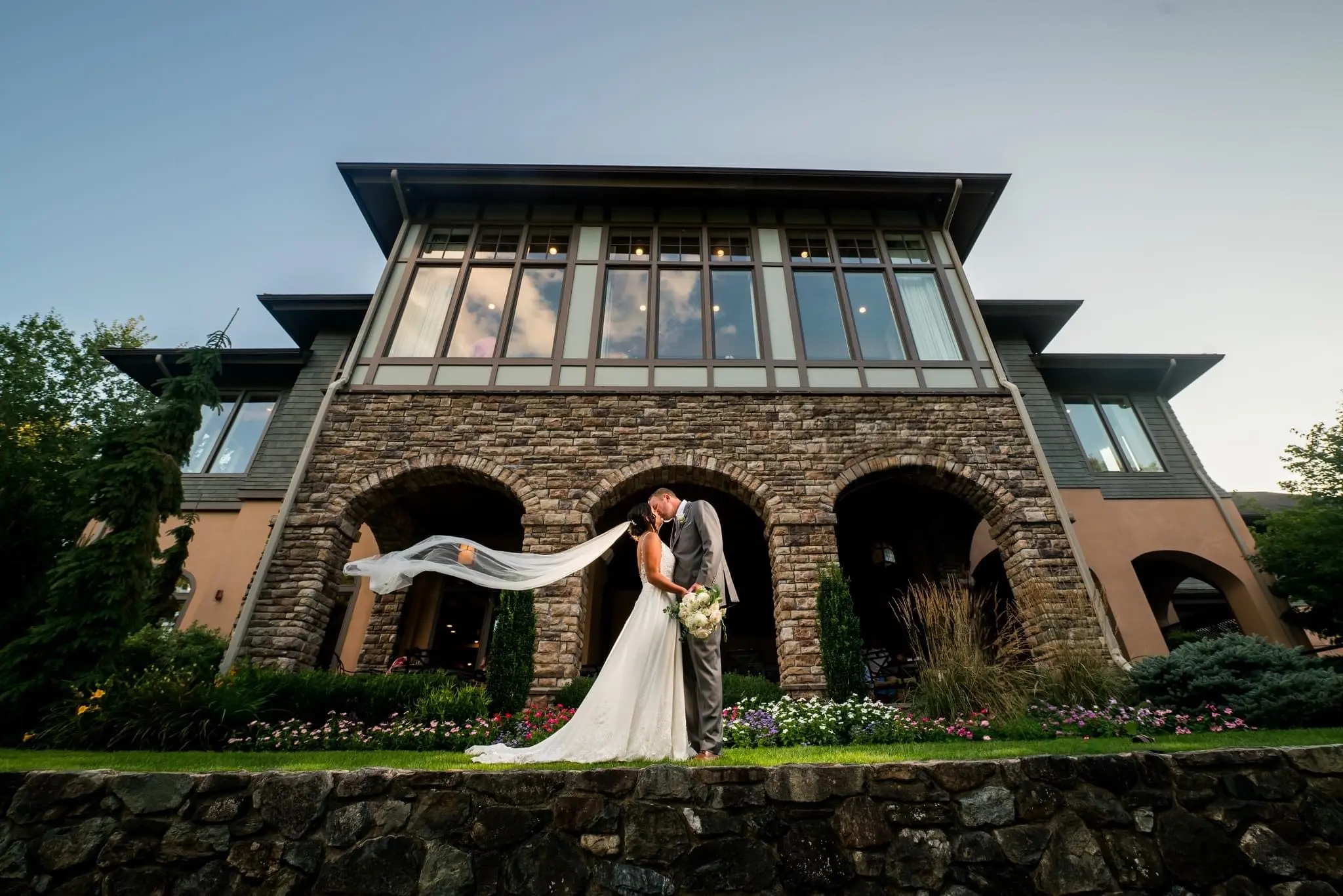 Groom With Bride Wearing Chiffon Wedding Dress With Flirty Lace Primrose By Maggie Sottero