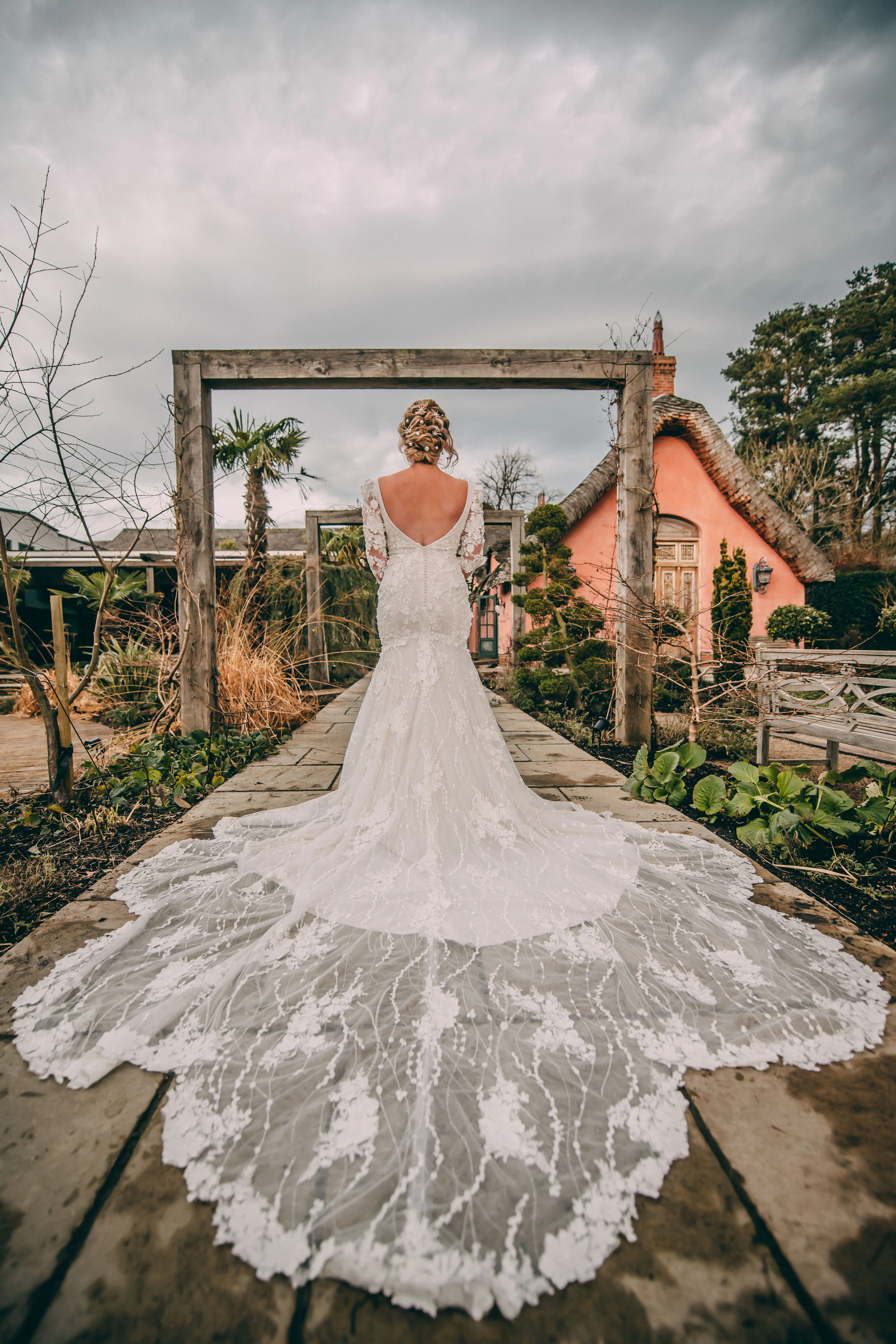 Bride Wearing Vintage Mermaid Wedding Dress With 3-D Floral Motifs Cruz By Sottero And Midgley