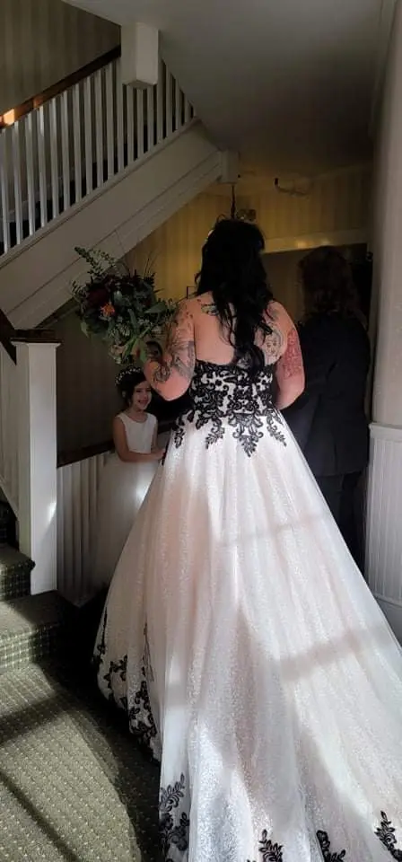 Bride wearing Black Lace Ballgown Wedding Dress called Tristyn by Maggie Sottero