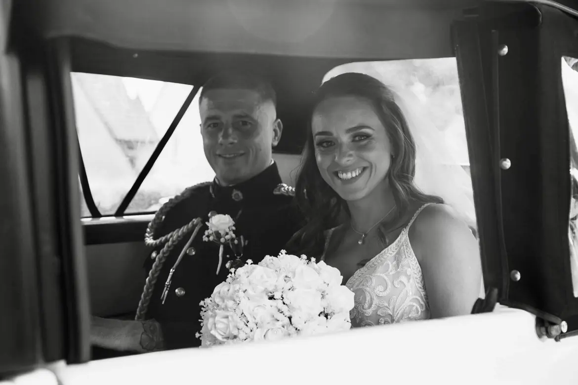 Bride Wearing Boho Lace Wedding Dress Called Roxanne By Sottero And Midgley In A Car