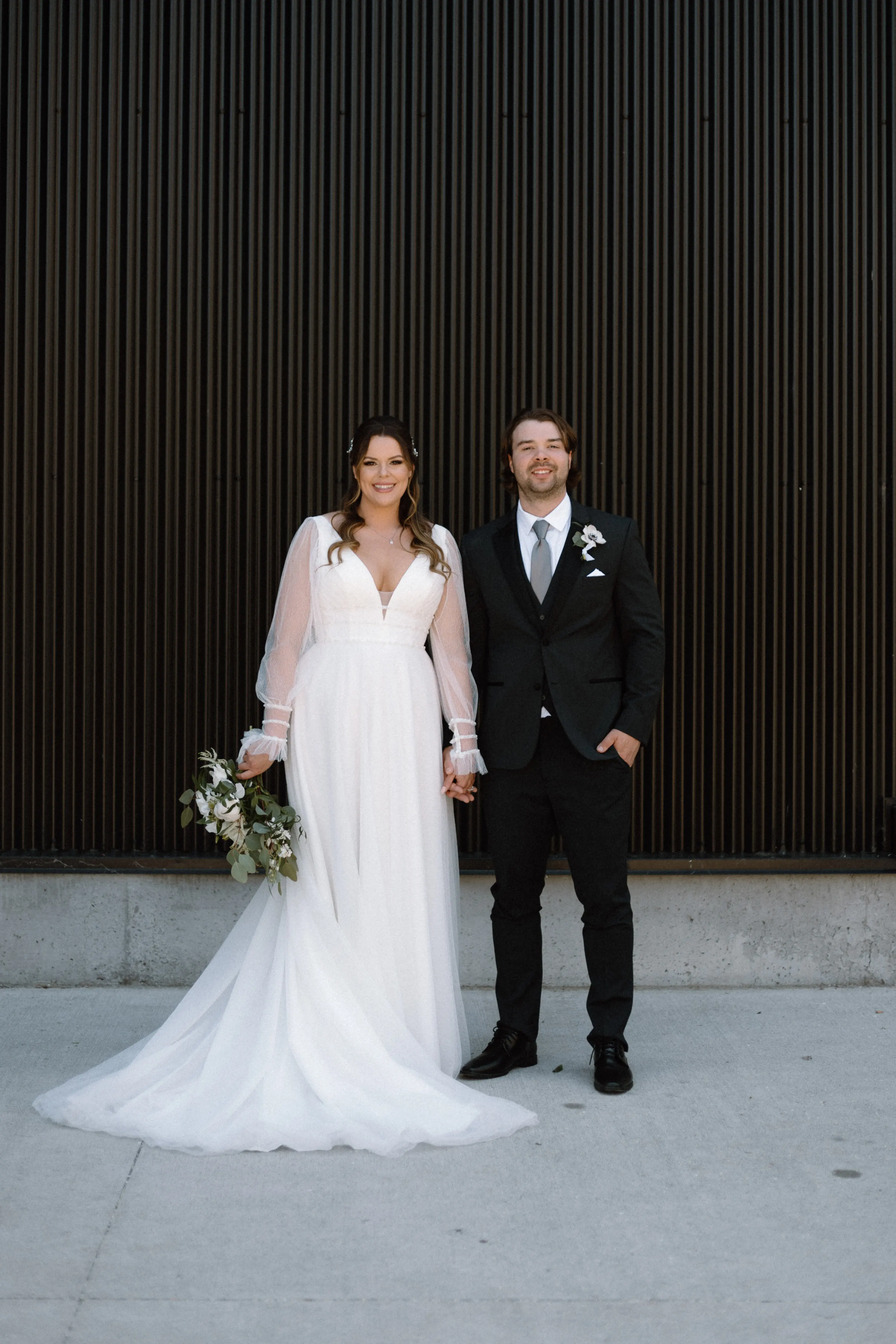 Bride In Bishop Sleeve Wedding Dress Called Joanne By Rebecca Ingram With Groom