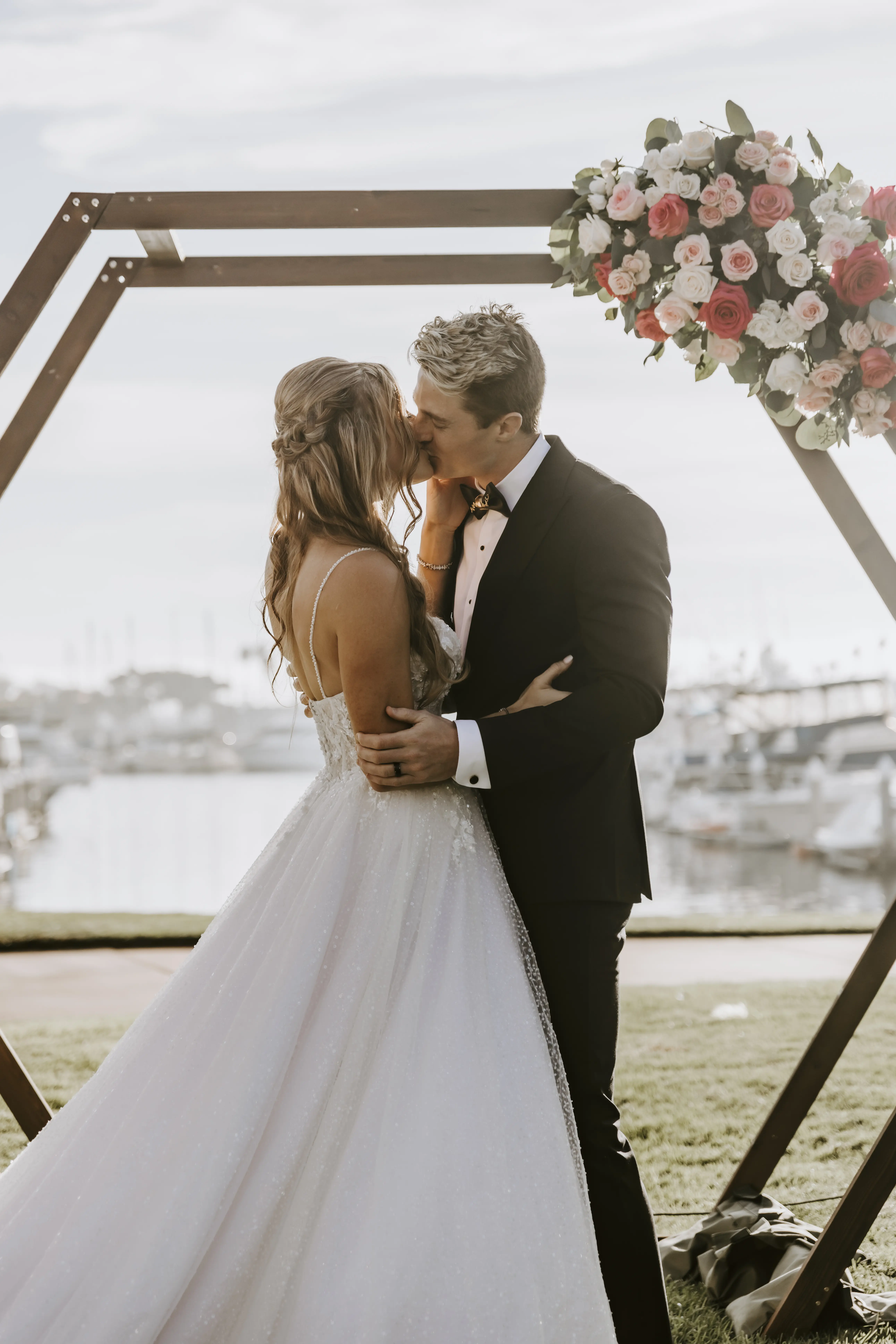Bride Wearing Sparkly Ballgown Wedding Dress Called Shasta By Sottero And Midgley Kissing Groom At The Altar
