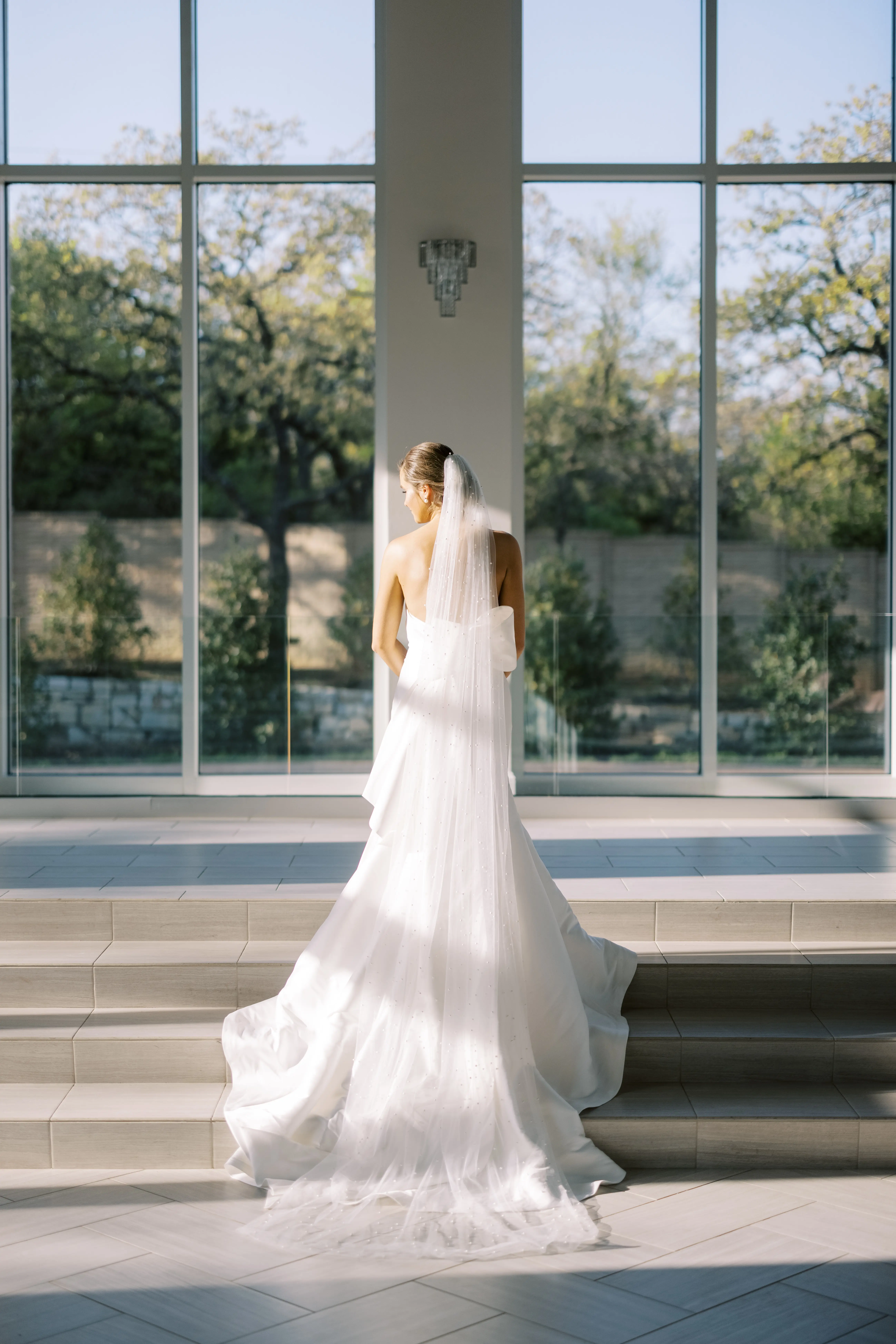 Bride Wearing Simple Sheath Wedding Dress With Bow Back Called Mitchell By Maggie Sottero
