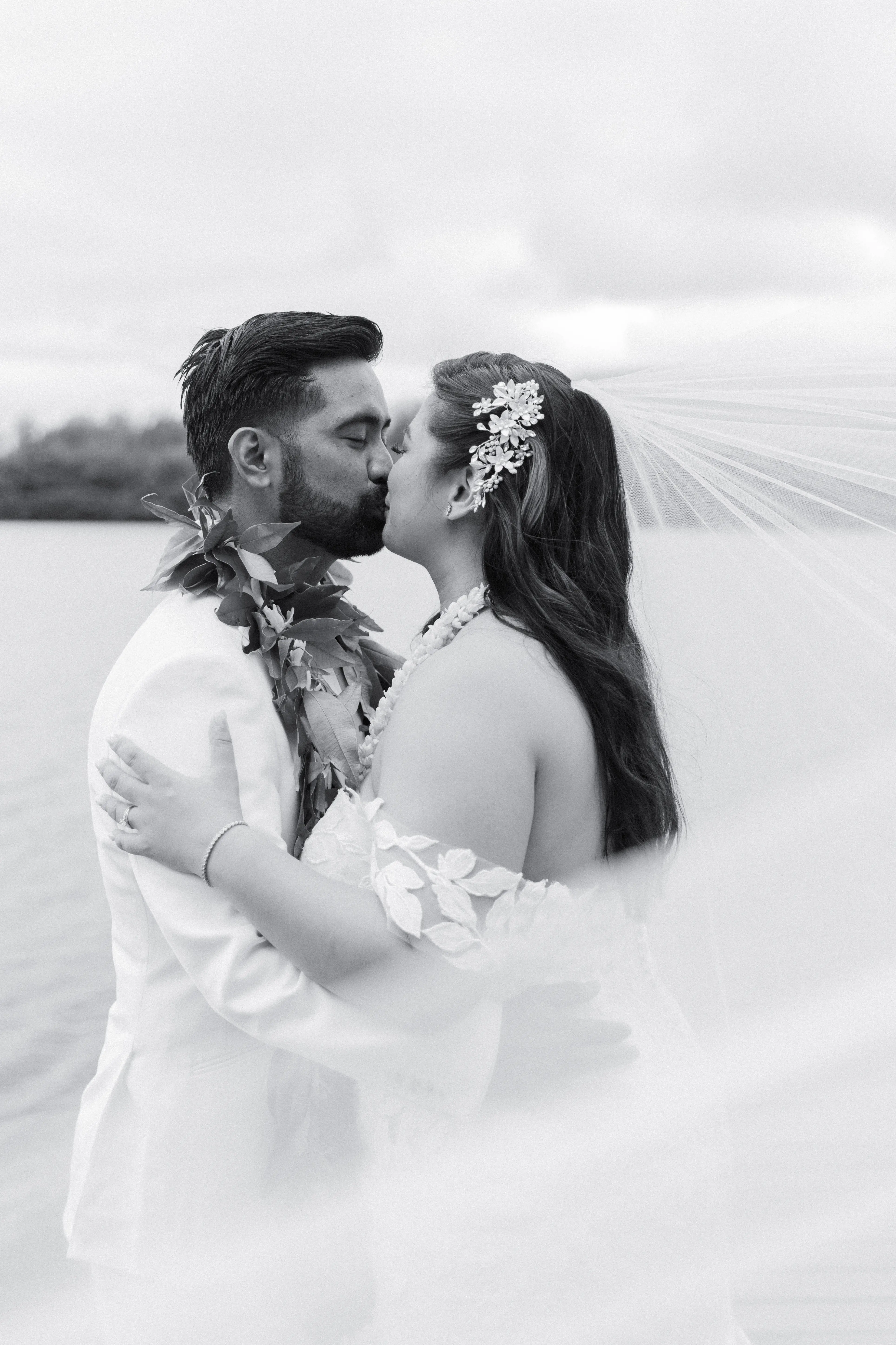 Bride Wearing Lace Mermaid Wedding Dress Called Hattie By Rebecca Ingram Kissing Groom
