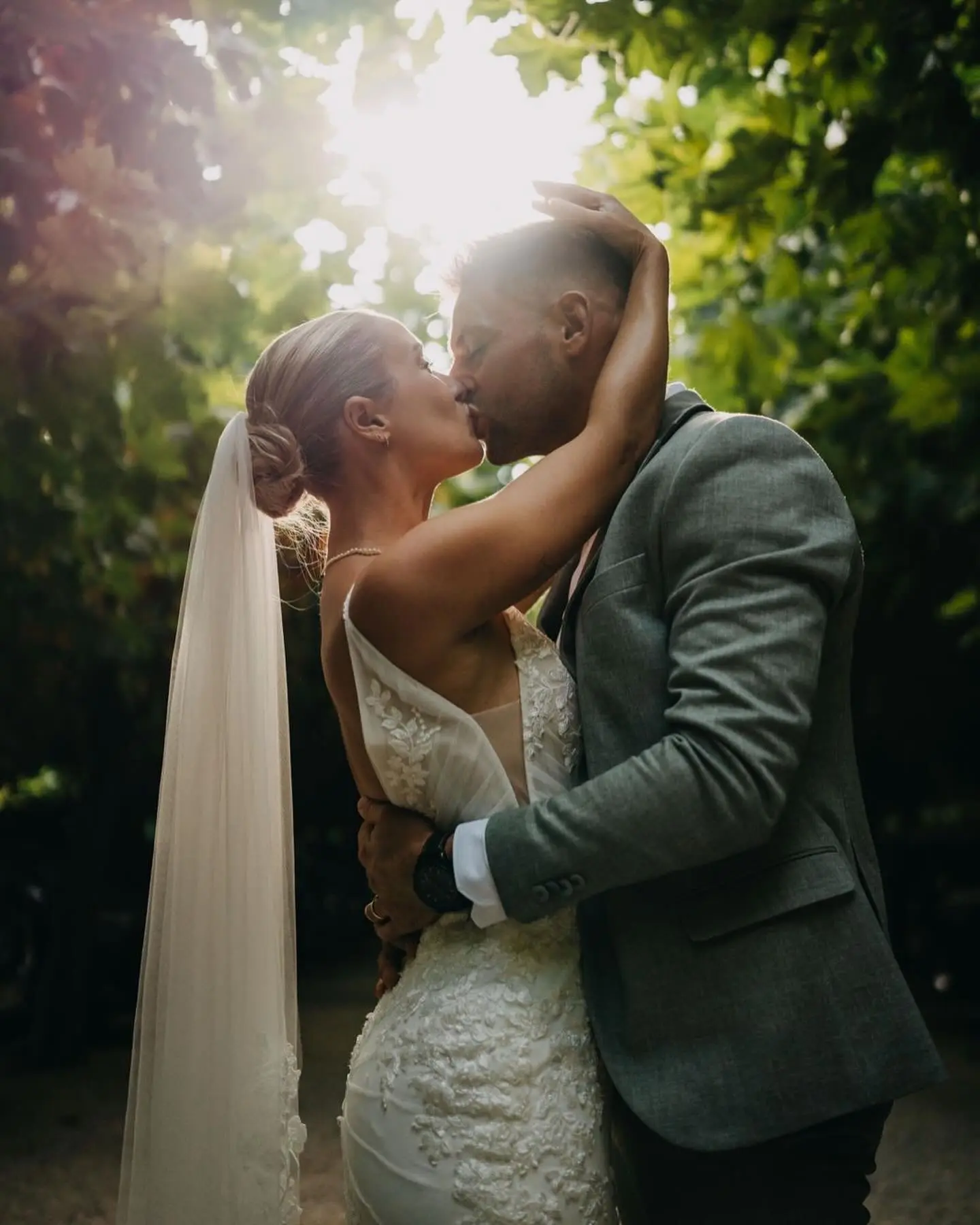 Bride wearing Fontaine by Maggie Sottero kissing her husband