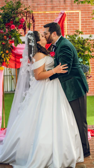 Bride wearing Anniston Marie by Maggie Sottero kissing her husband