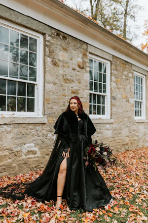 Bride Wearing Black Aline Wedding Dress Called Scarlet By Maggie Sottero In Fall Leaves