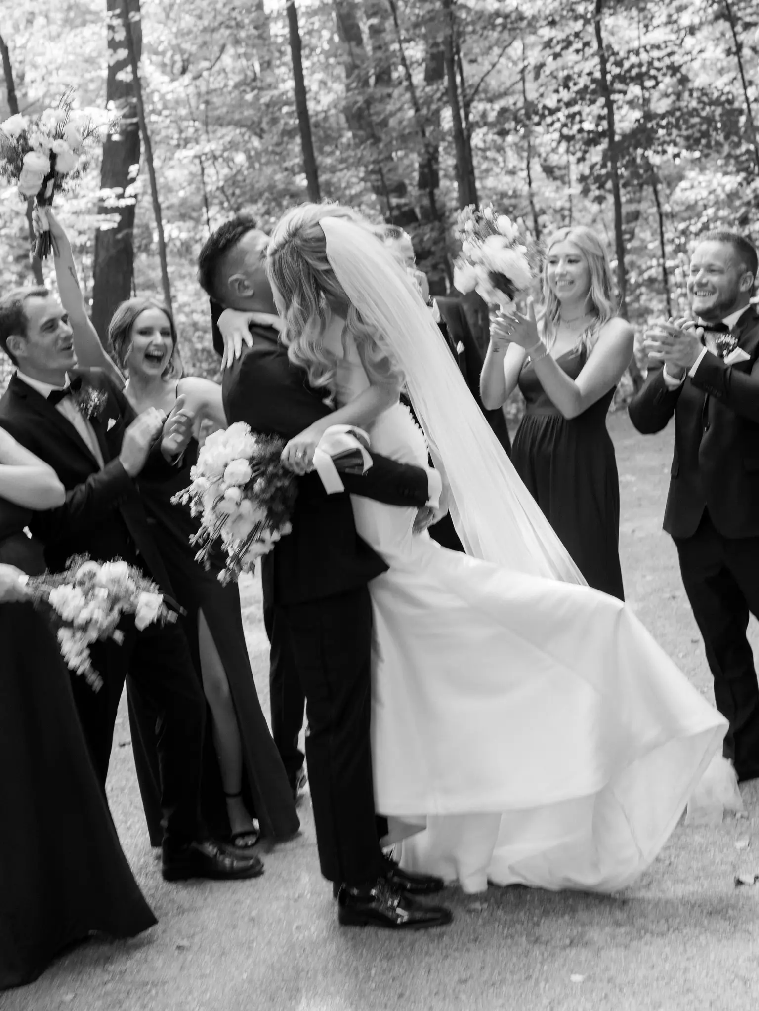 Bride Wearing Simple Fit And Flare Wedding Dress Called Mitchell Marie By Maggie Sottero Kissing Groom