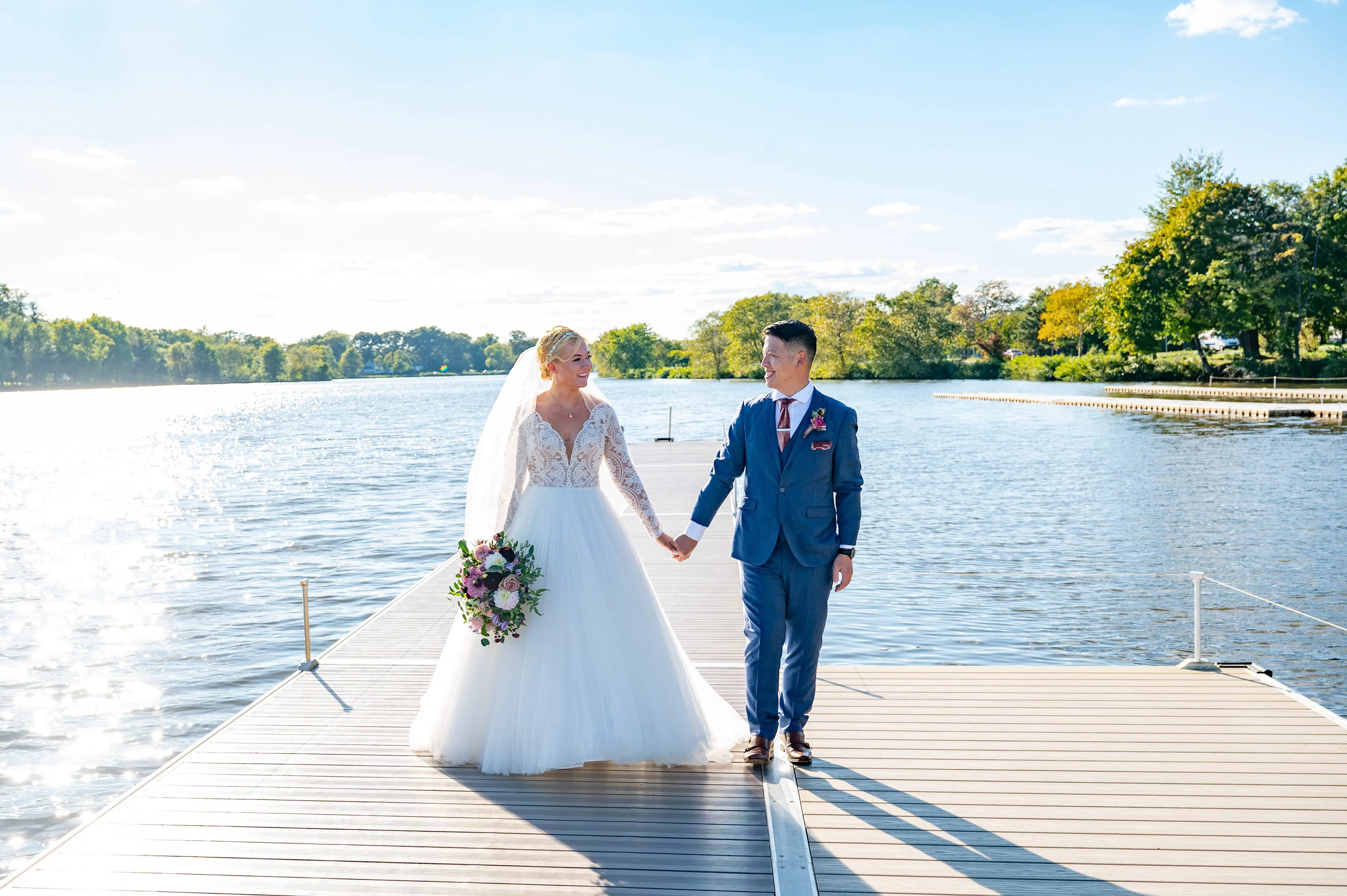 Bride Wearing Princess Ballgown Wedding Dress Called Mallory Dawn By Maggie Sottero Holding Hands With Groom