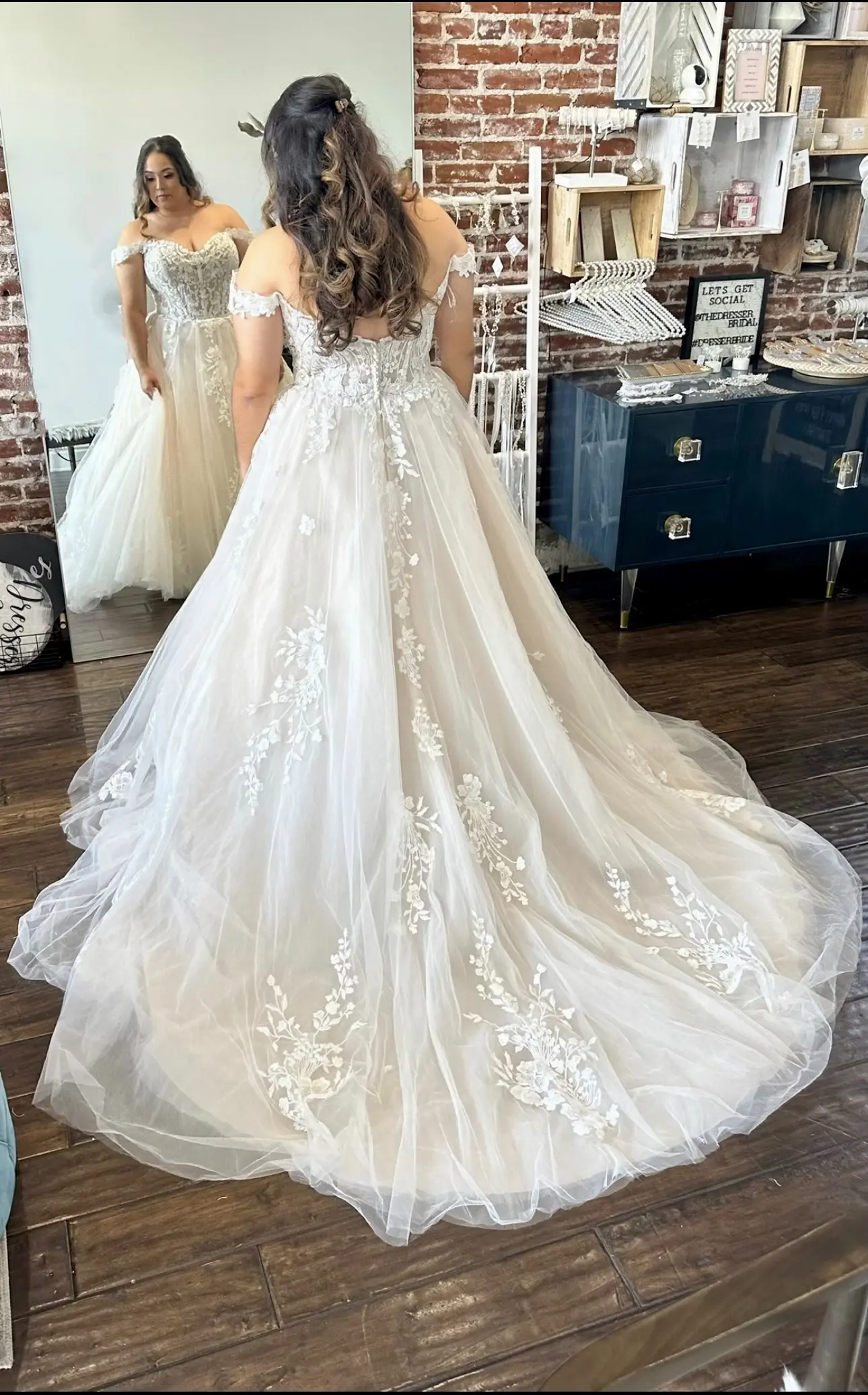 Bride Wearing Lace Ballgown Wedding Dress Called Harlem By Maggie Sottero Looking At Herself In A Mirror