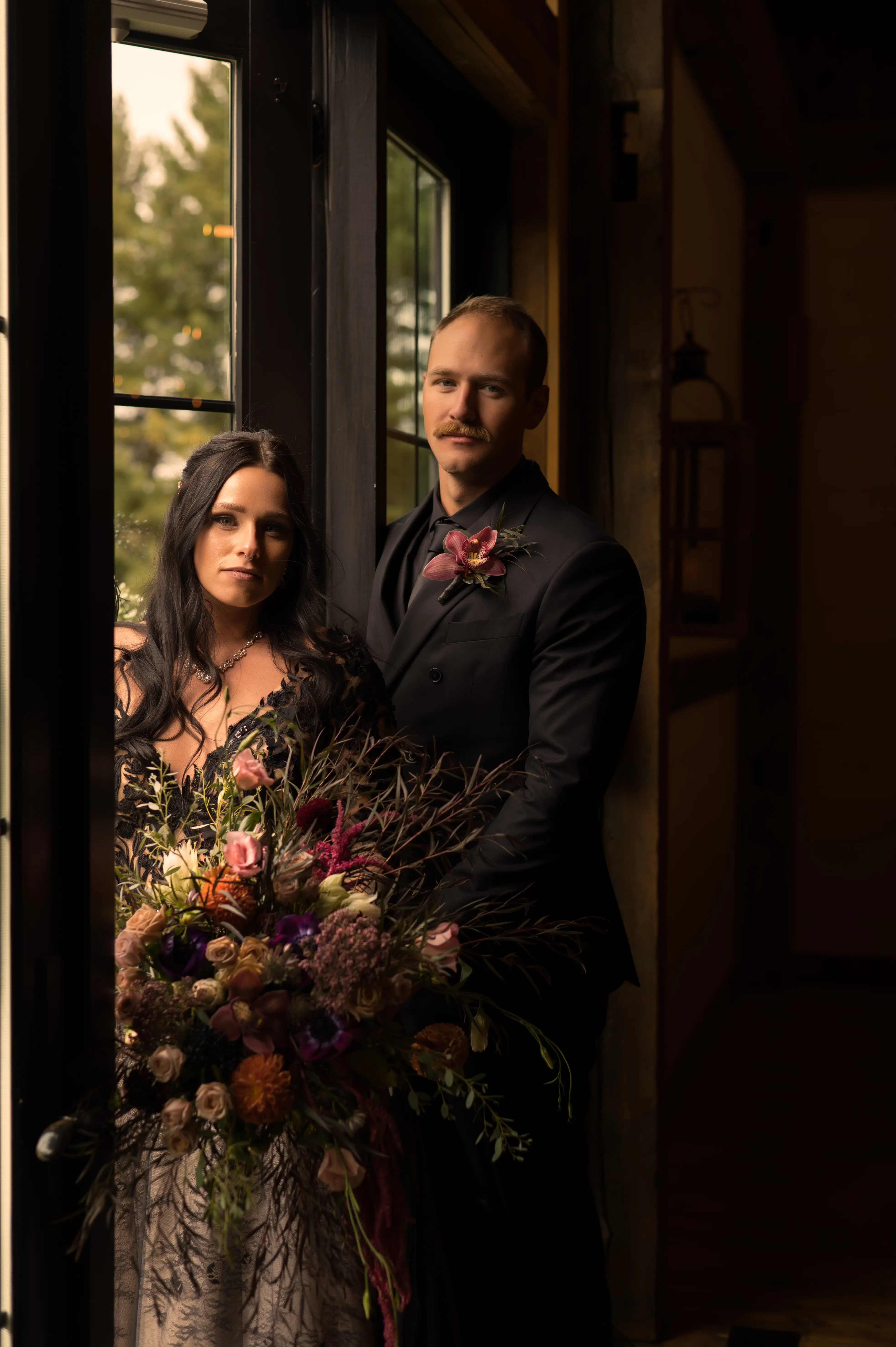 Bride Wearing Black Lace Wedding Dress Called Zander By Sottero And Midgley And Groom In A Window