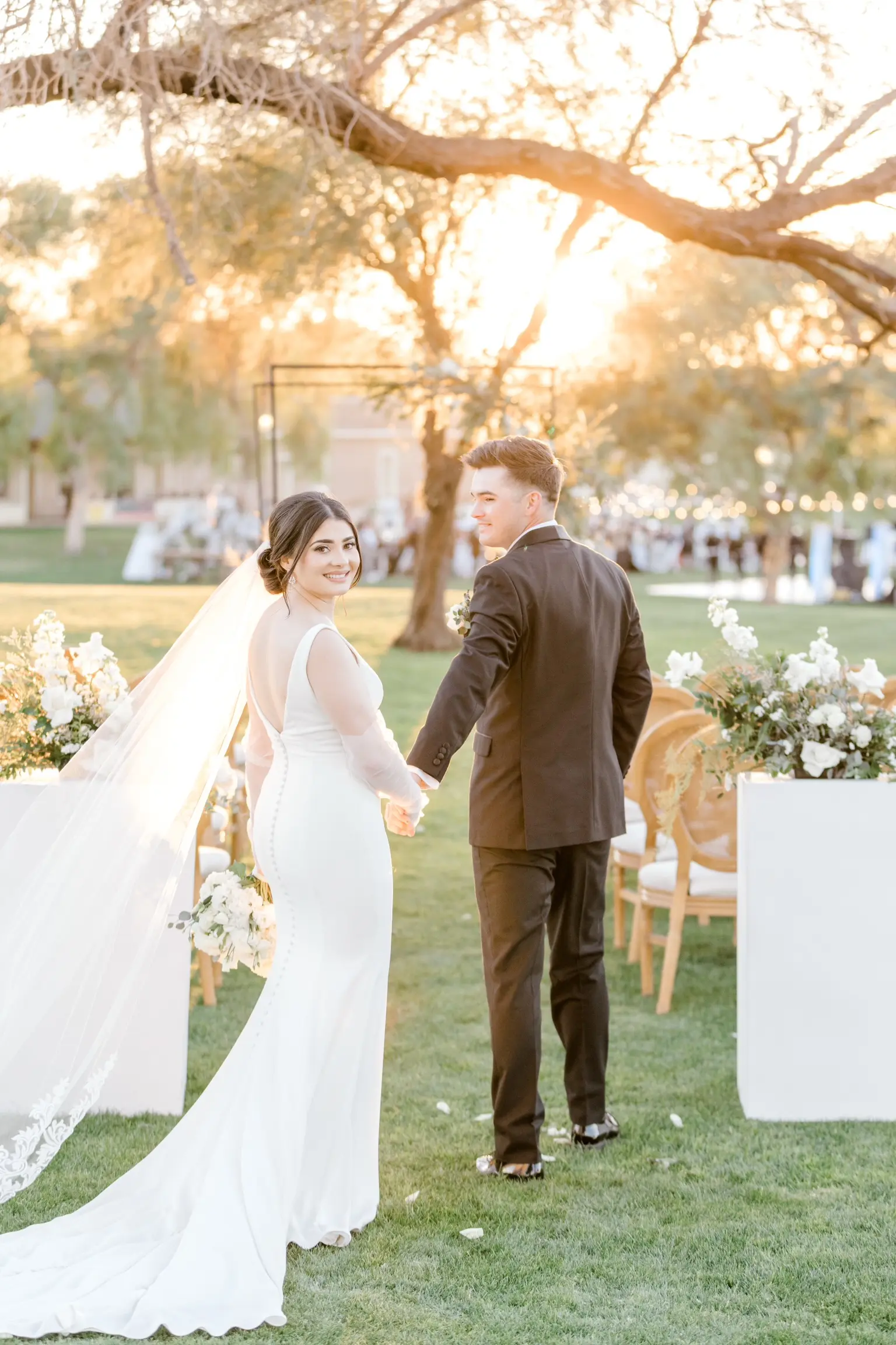Bride In Simple Crepe Wedding Dress Called Fernanda By Maggie Sottero With Gloves And Groom