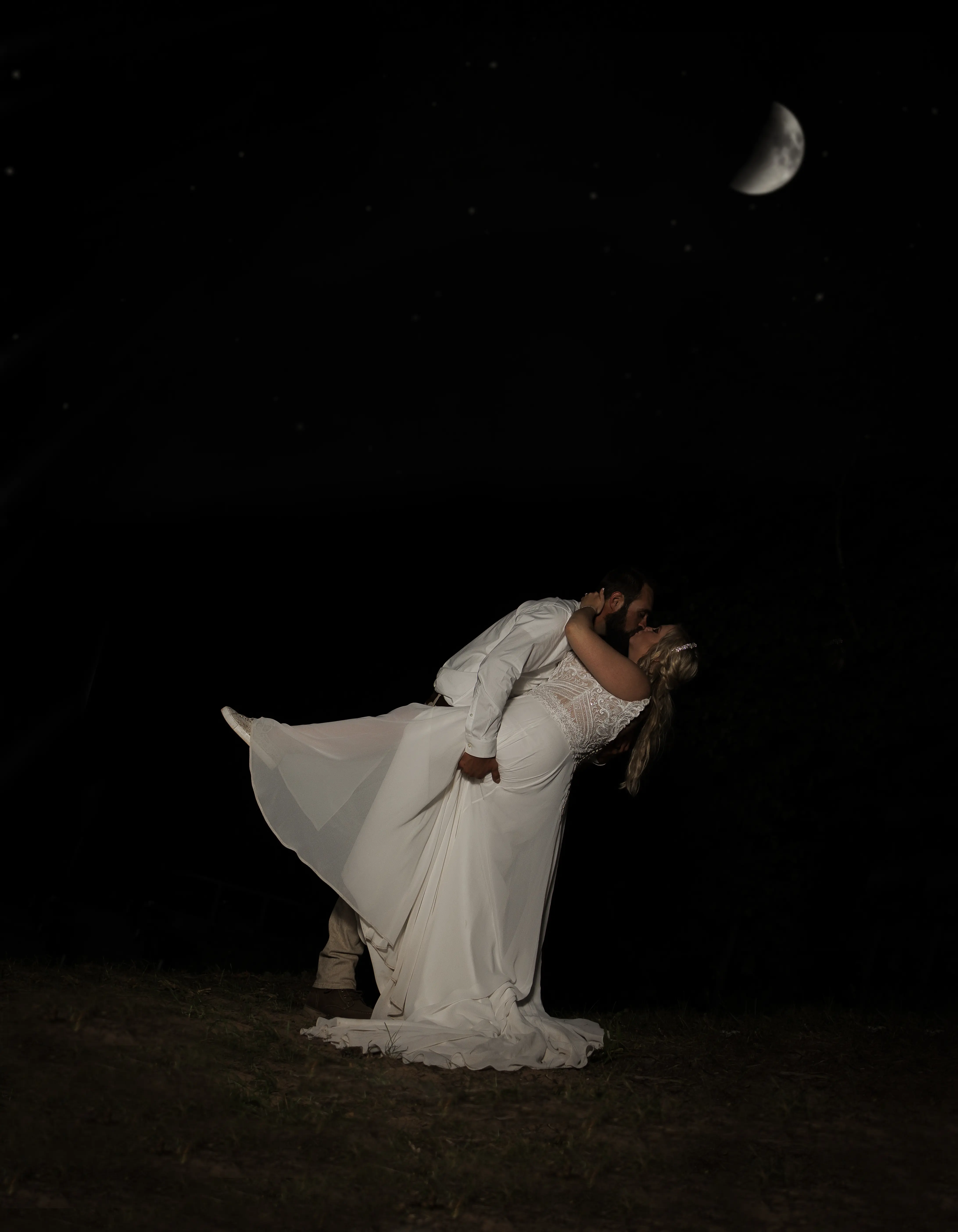 Bride Wearing Beaded Wedding Dress With Flowy Skirt Called Lorraine By Rebecca Ingram Dipped By Groom In The Moonlight