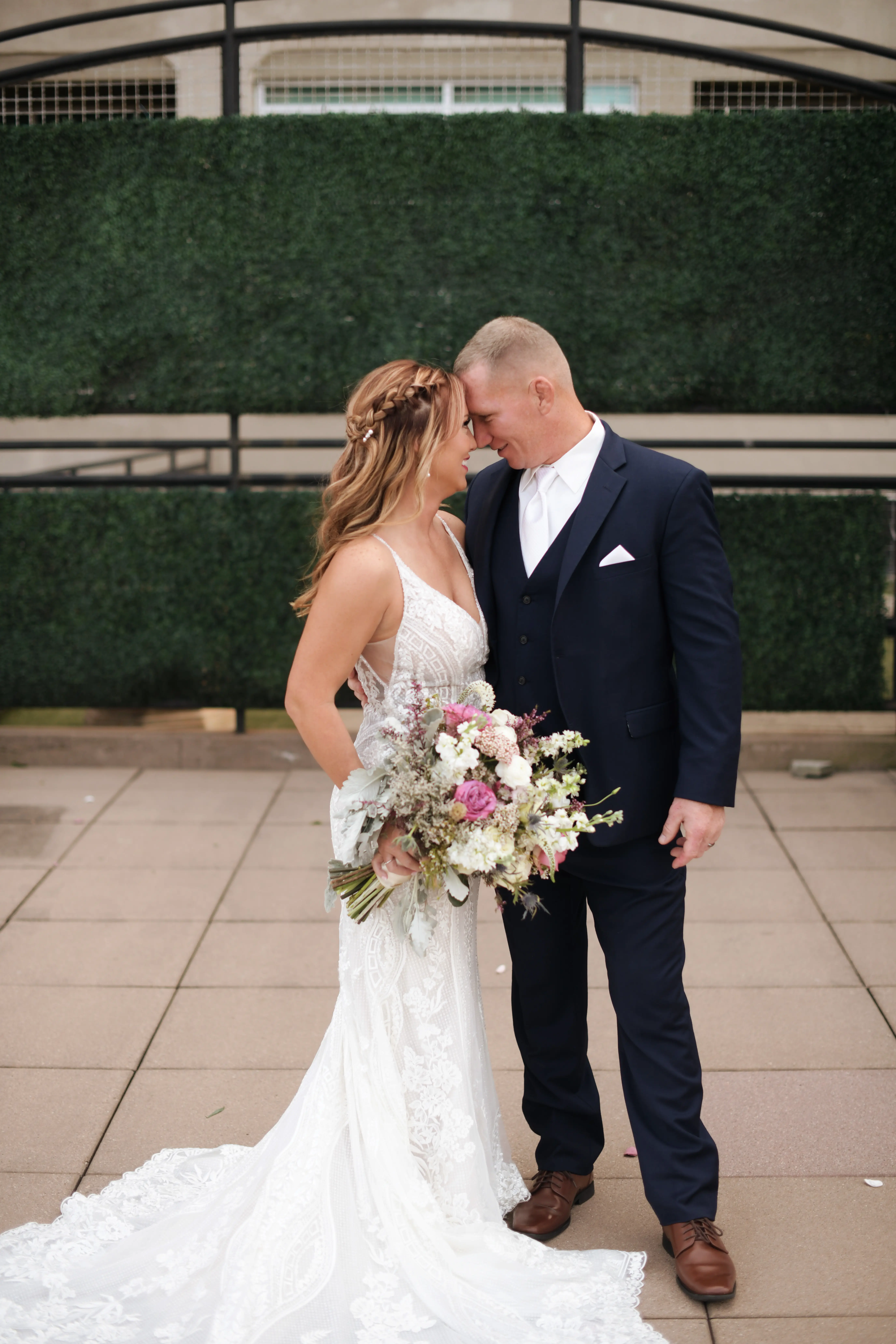 Groom with Bride in V-Neckline Wedding Gown Accented with Beaded Detail Called Bailey by Sottero & Midgley