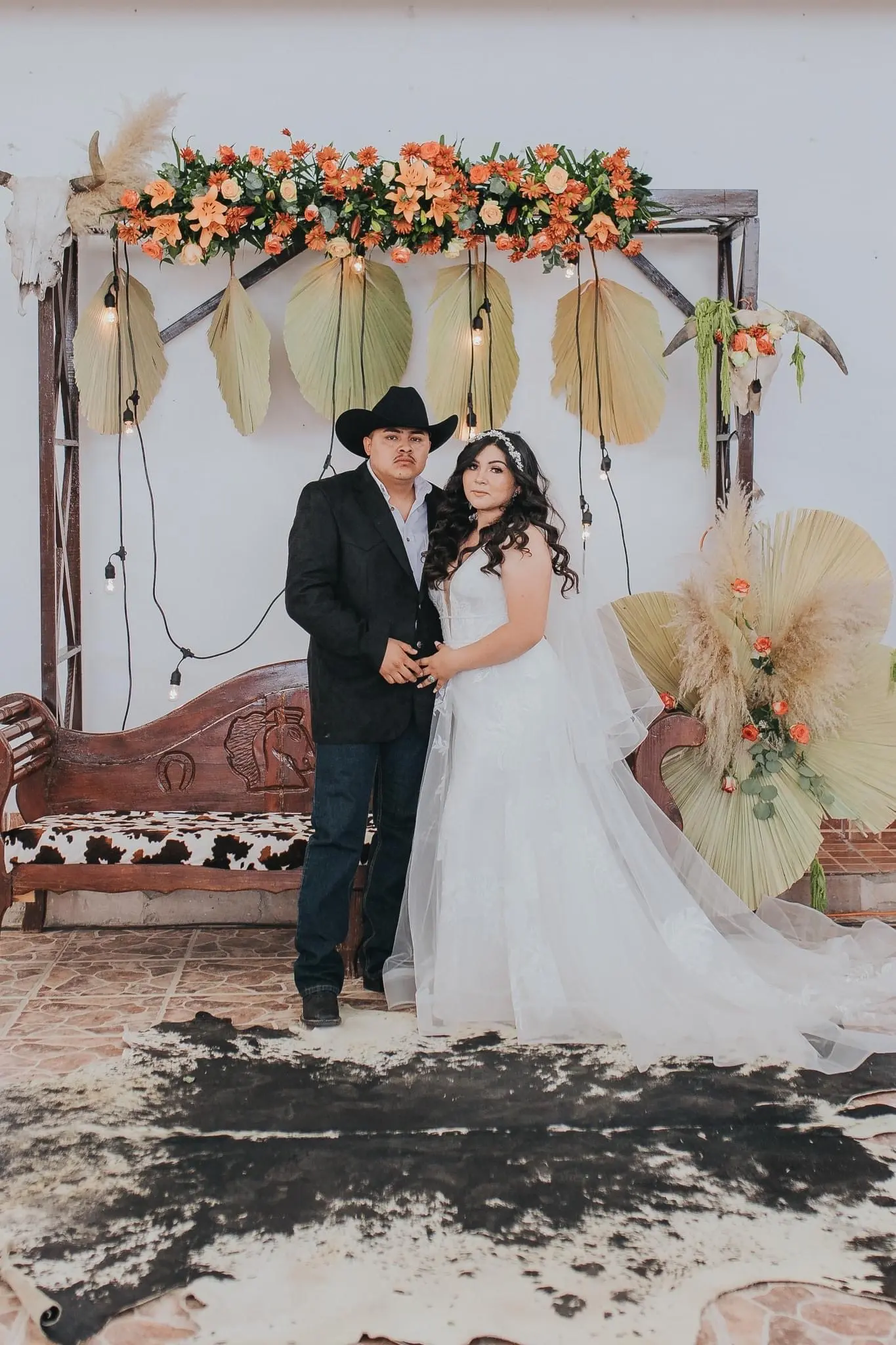 Groom with Bride at Cowboy Themed Wedding Wearing Dress Called Priscilla by Rebecca Ingram