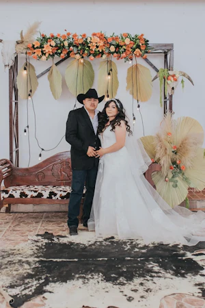 Groom with Bride at Cowboy Themed Wedding Wearing Dress Called Priscilla by Rebecca Ingram