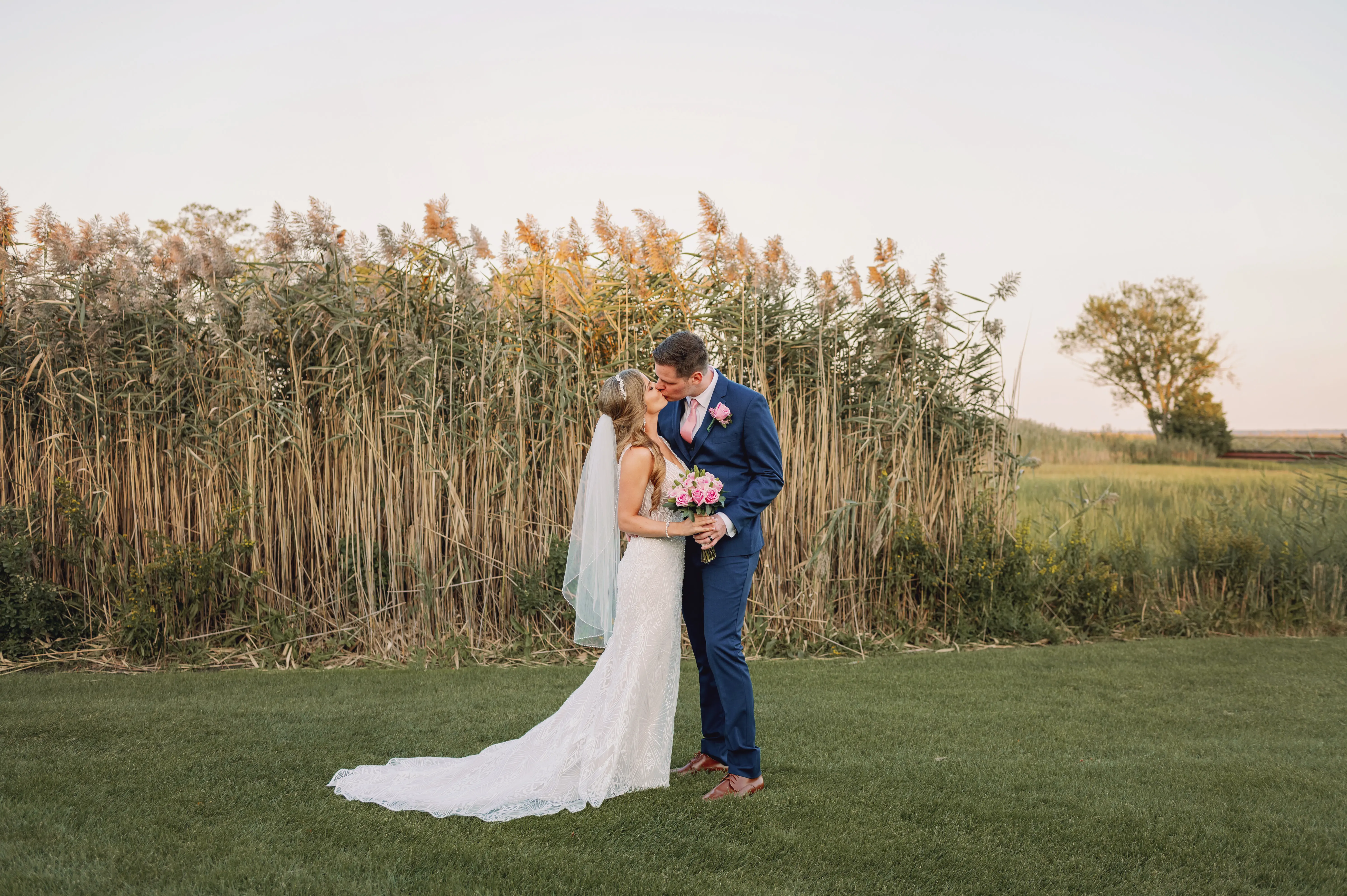 Bride and groom kissing.