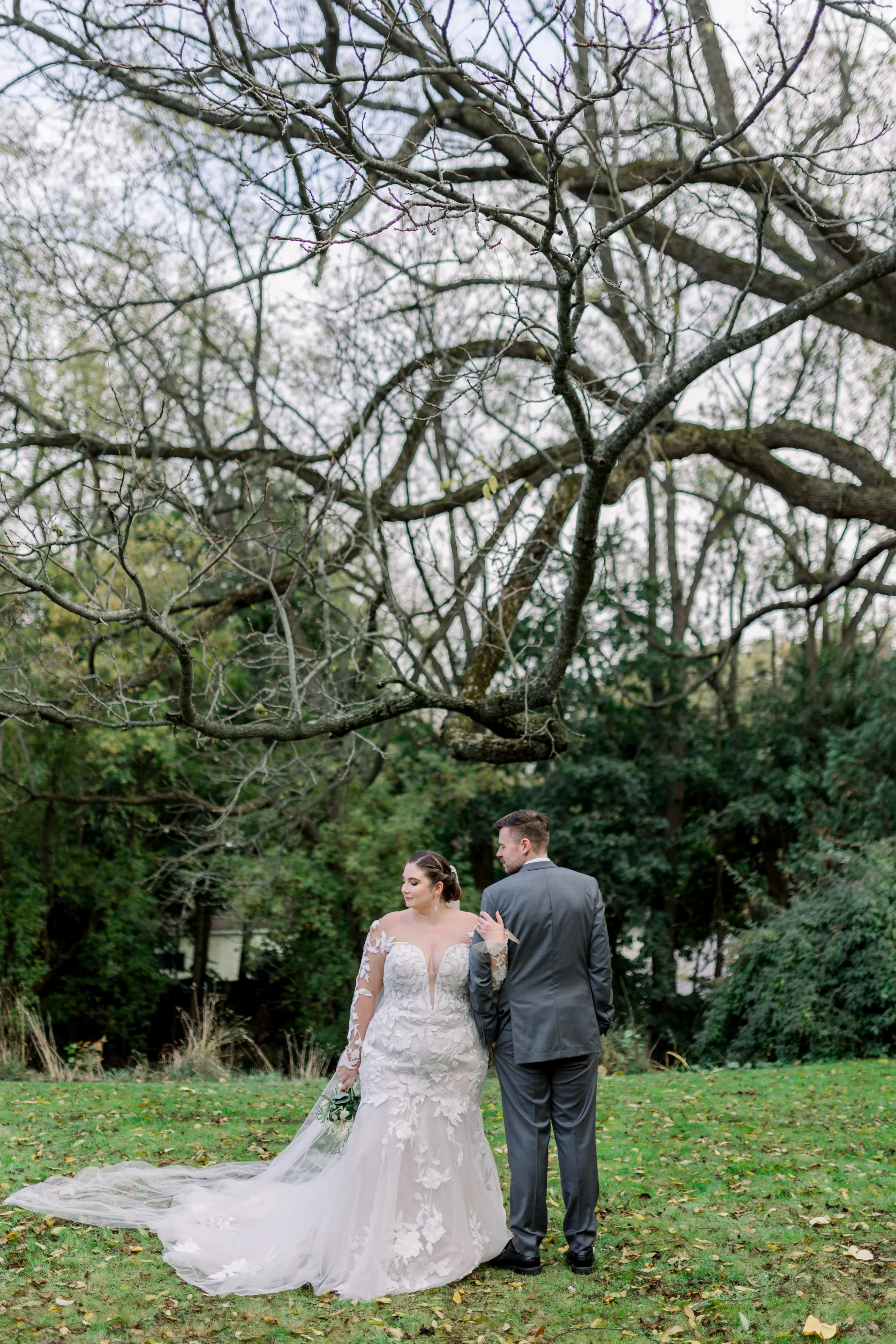 Bride wearing Hattie by Rebecca Ingram with her husband