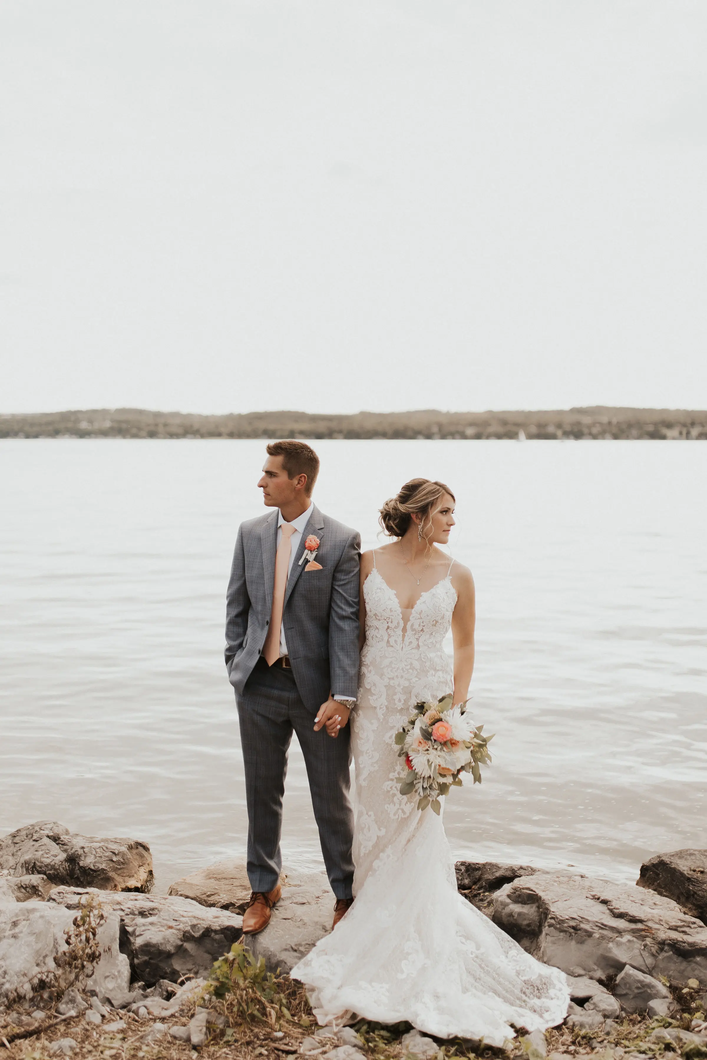 Bride Wearing Lace Sexy Wedding Dress Called Tuscany Lynette By Maggie Sottero With Groom By A Lake