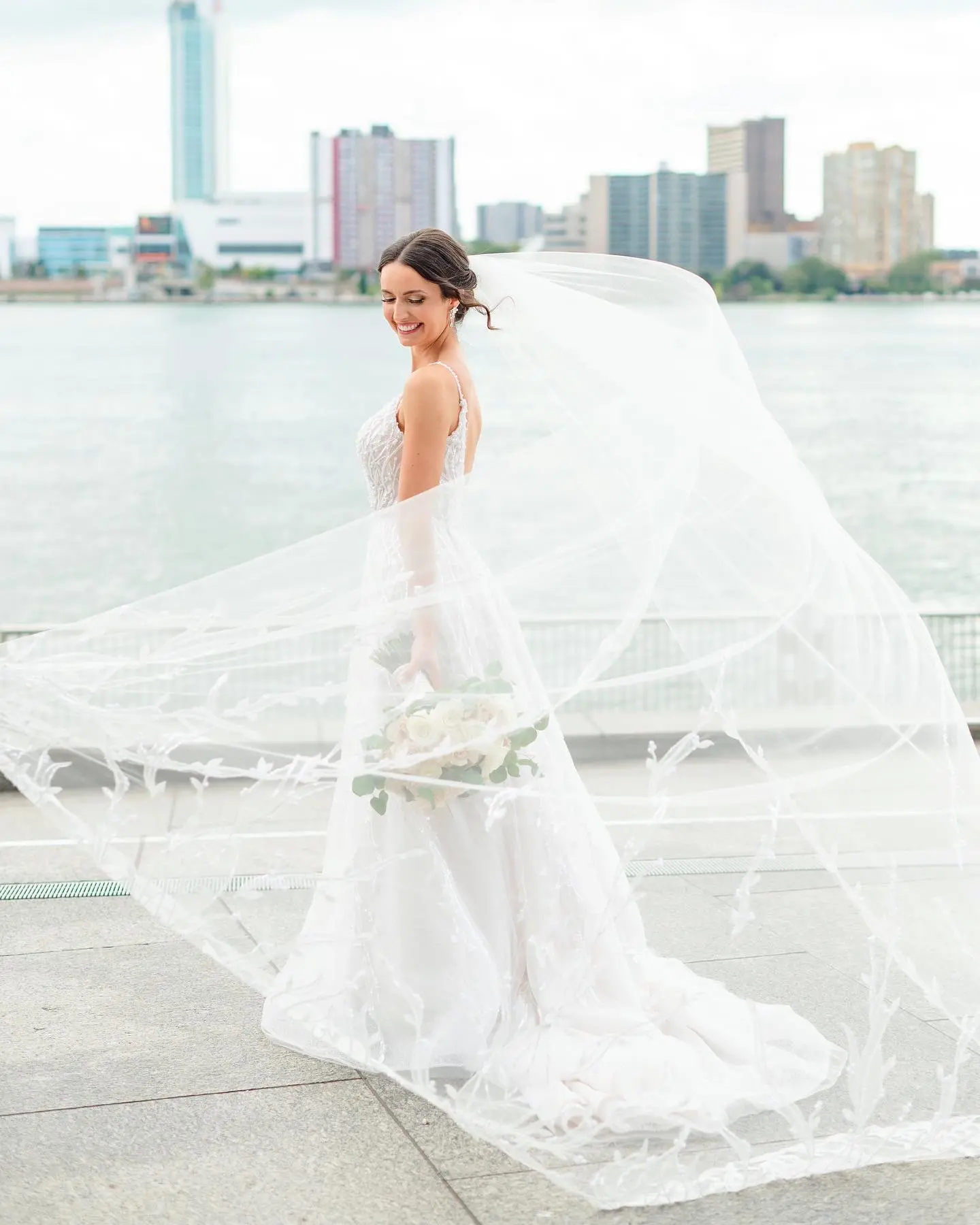Bride wearing Marvine wedding gown by Sottero and Midgley