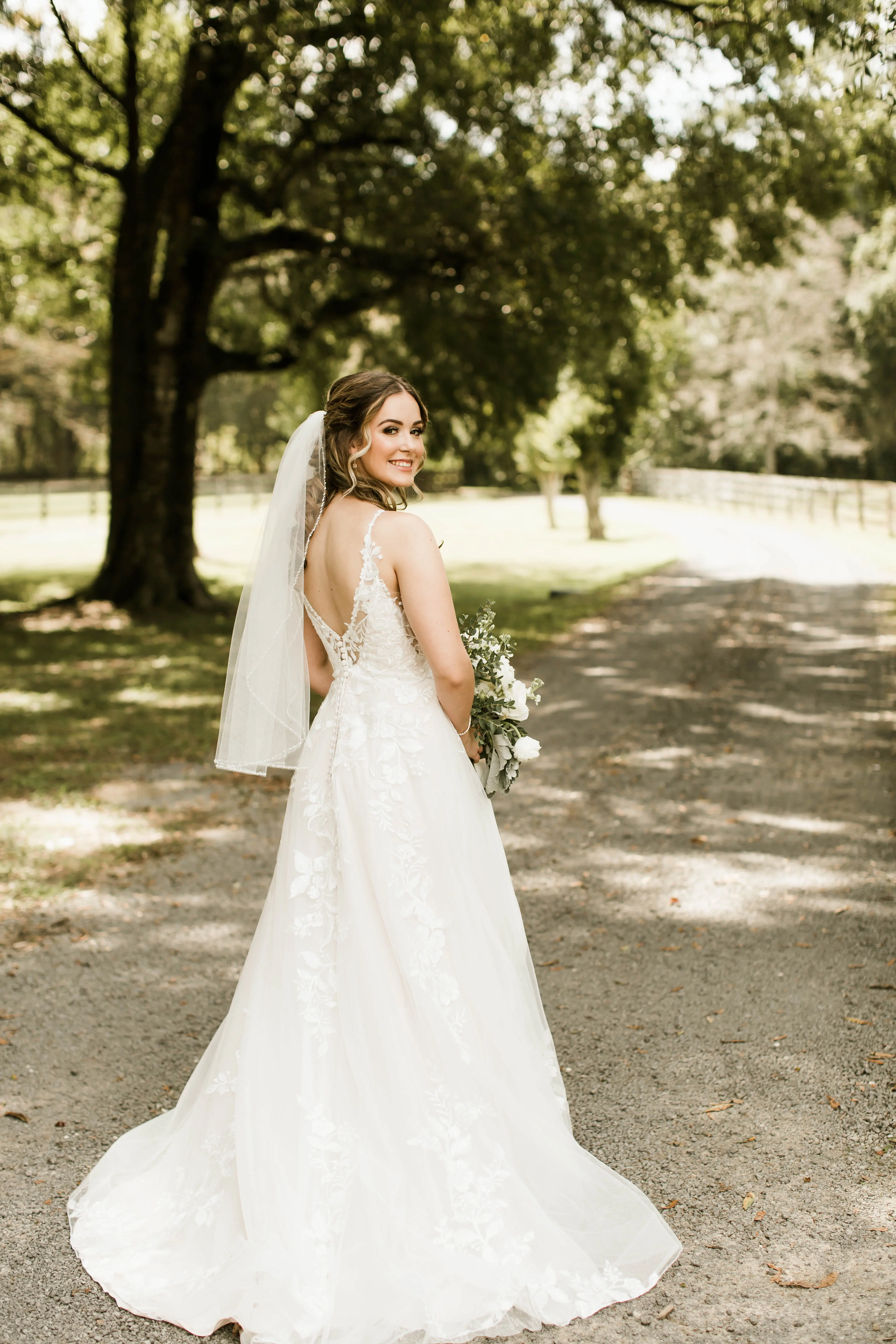 Bride wearing affordable floral ballgown wedding dress.