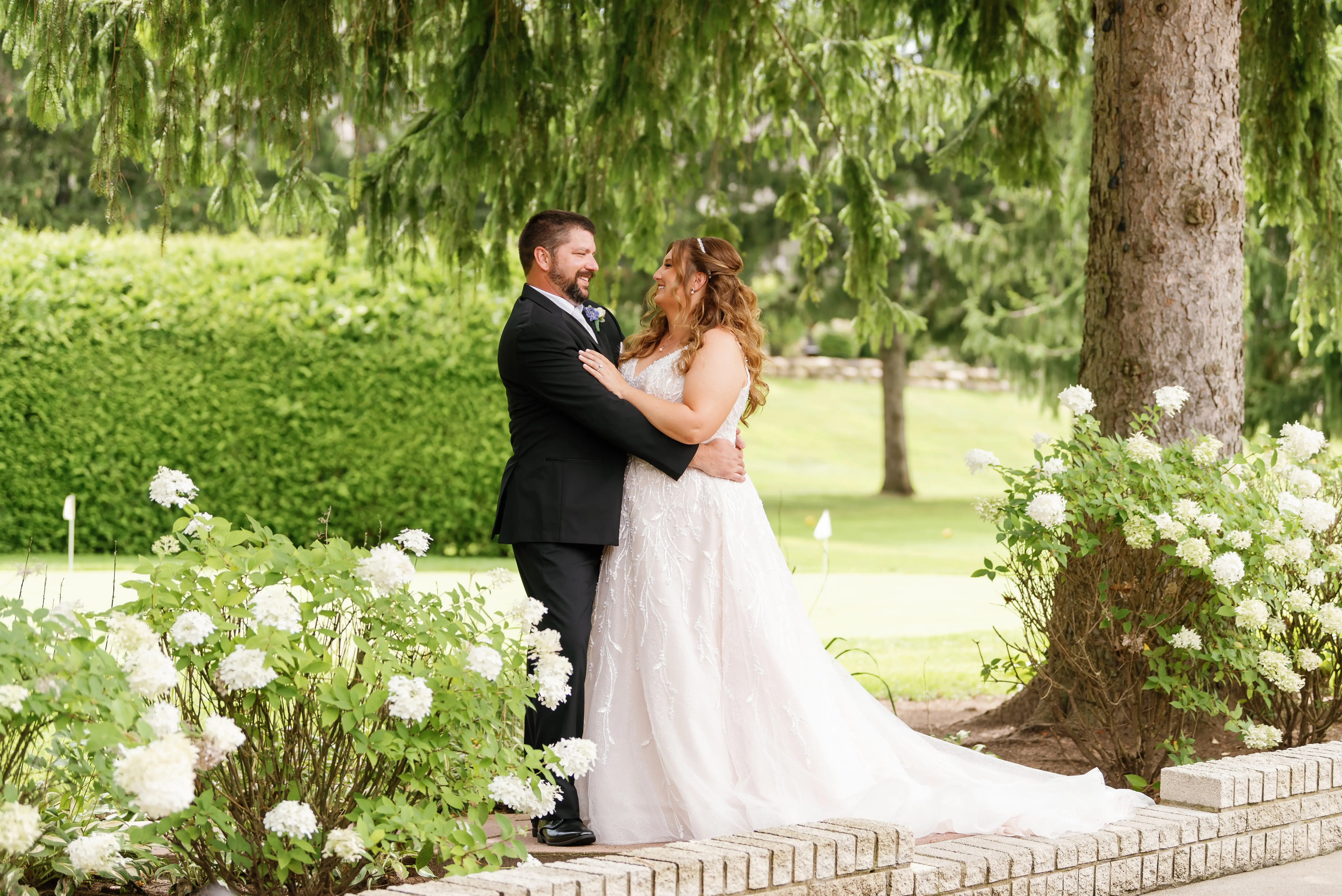 Bride Wearing Beaded Wedding Dress Called Marvine By Sottero And Midgley With Groom