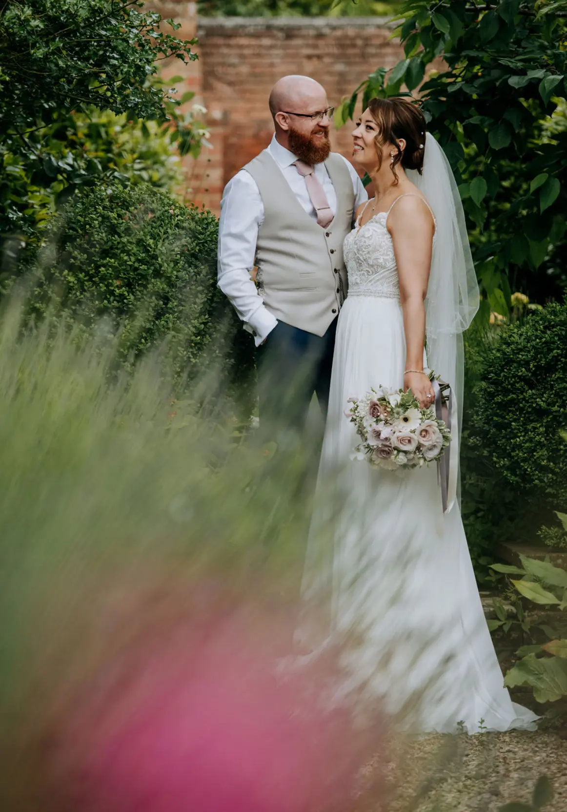 Bride wearing Lorraine by Rebecca Ingram with her husband