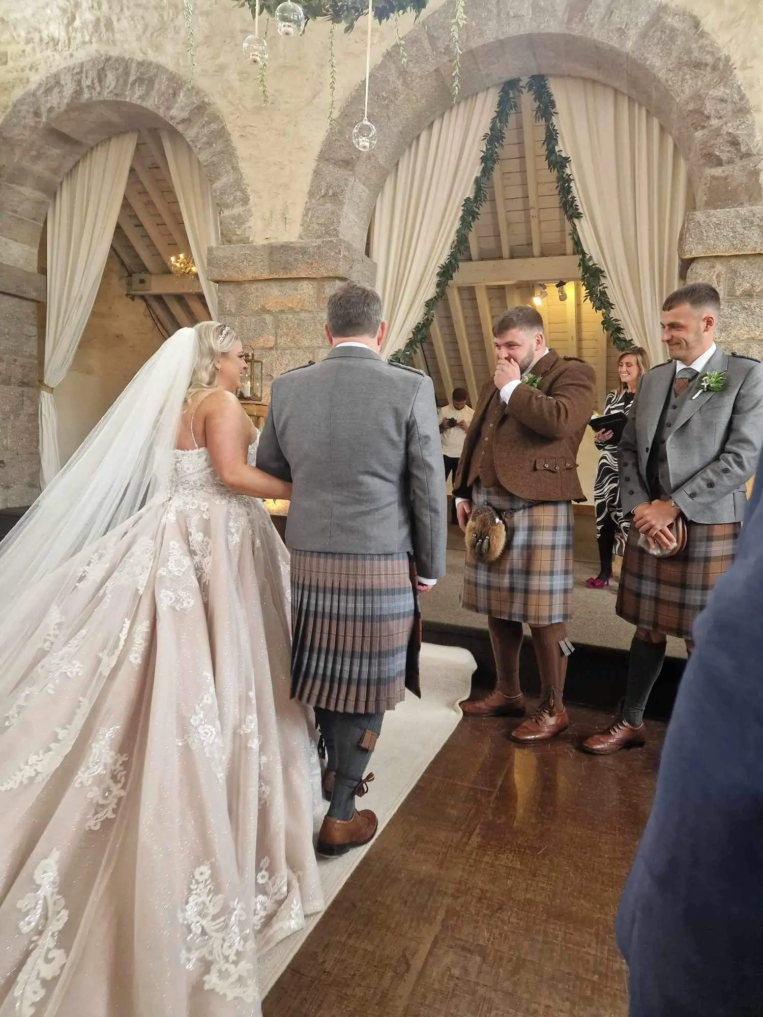 Bride wearing Norvinia by Sottero and Midgley being given away
