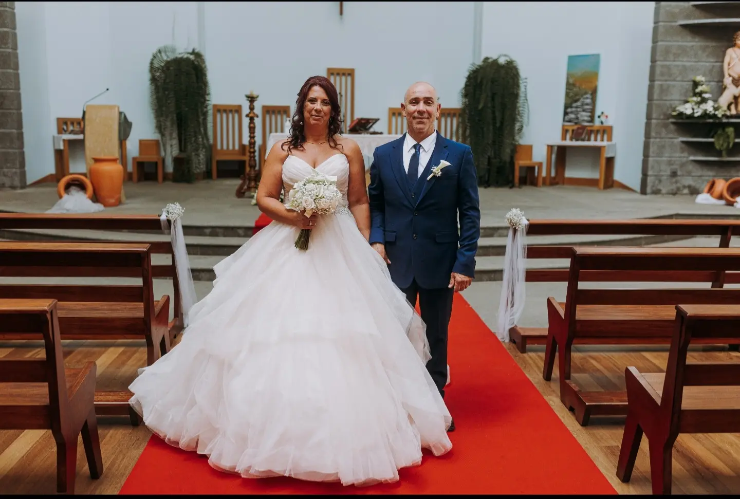 Bride Wearing Sparkly Ballgown Wedding Dress Called Yasmin By Maggie Sottero With Groom In A Chapel