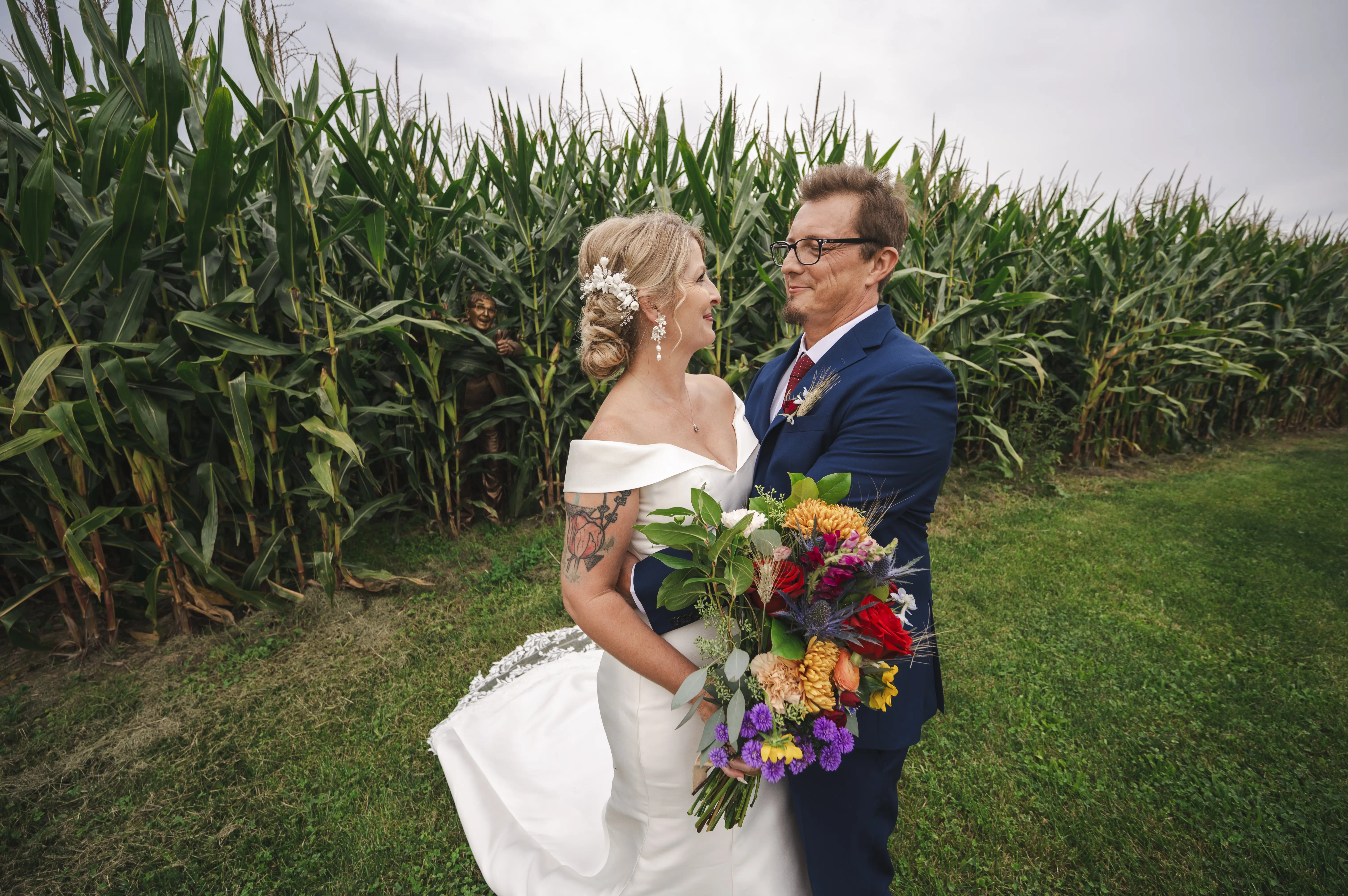 Bride wearing Josie by Rebecca Ingram smiling at her husband