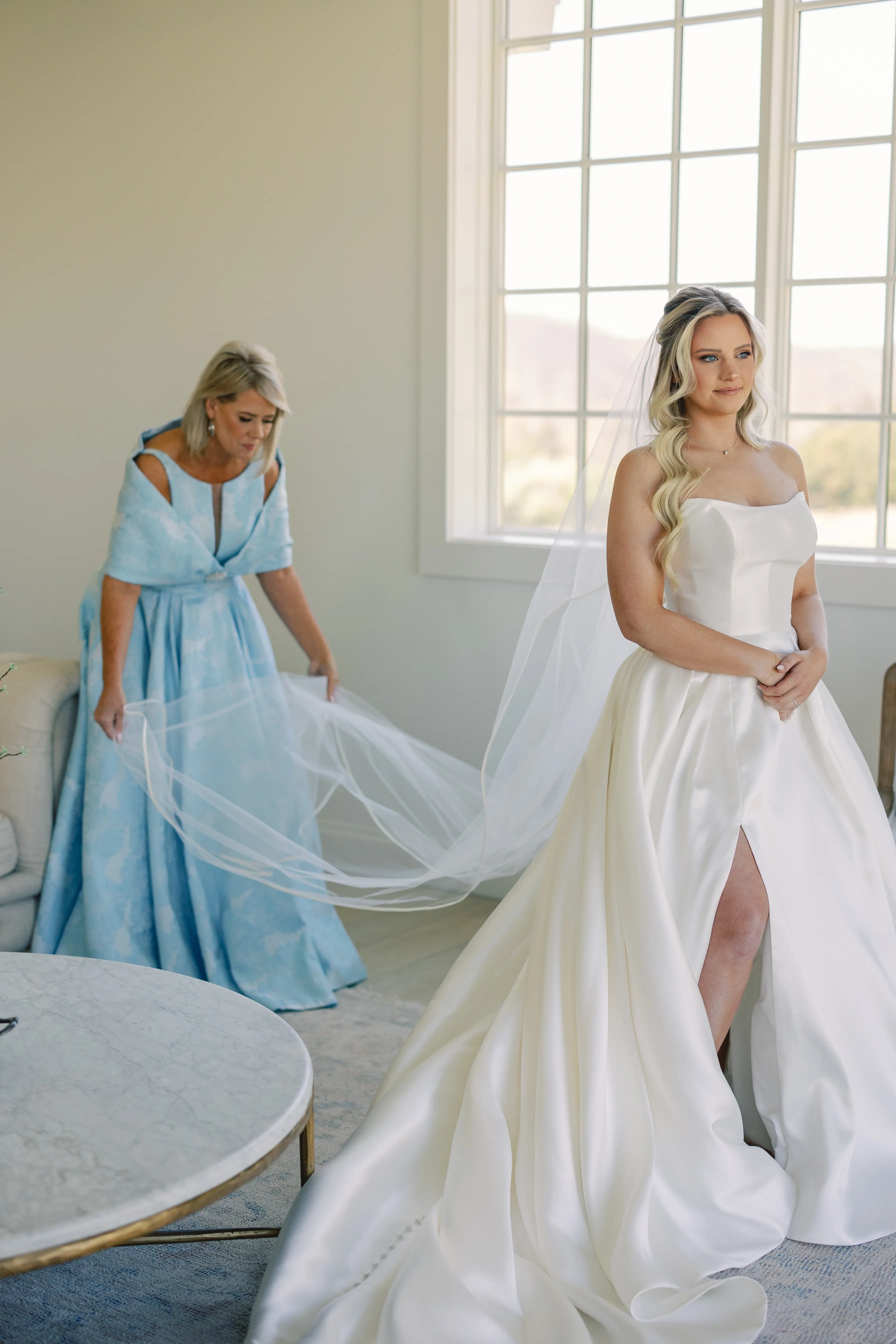 Bride wearing Selena by Maggie Sottero having her veil fluffed by her mother